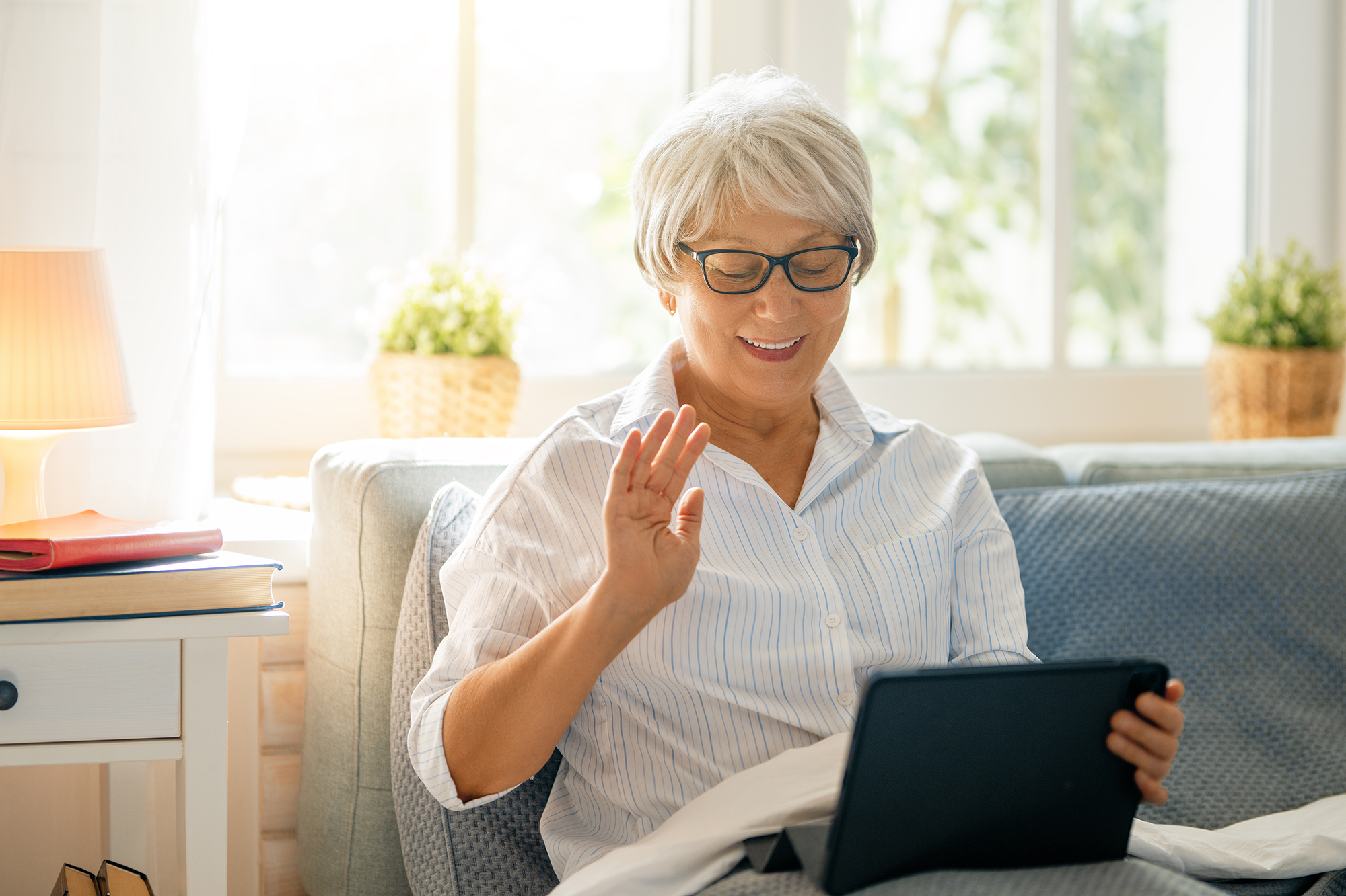 An elderly patient receiving remote care support at home
