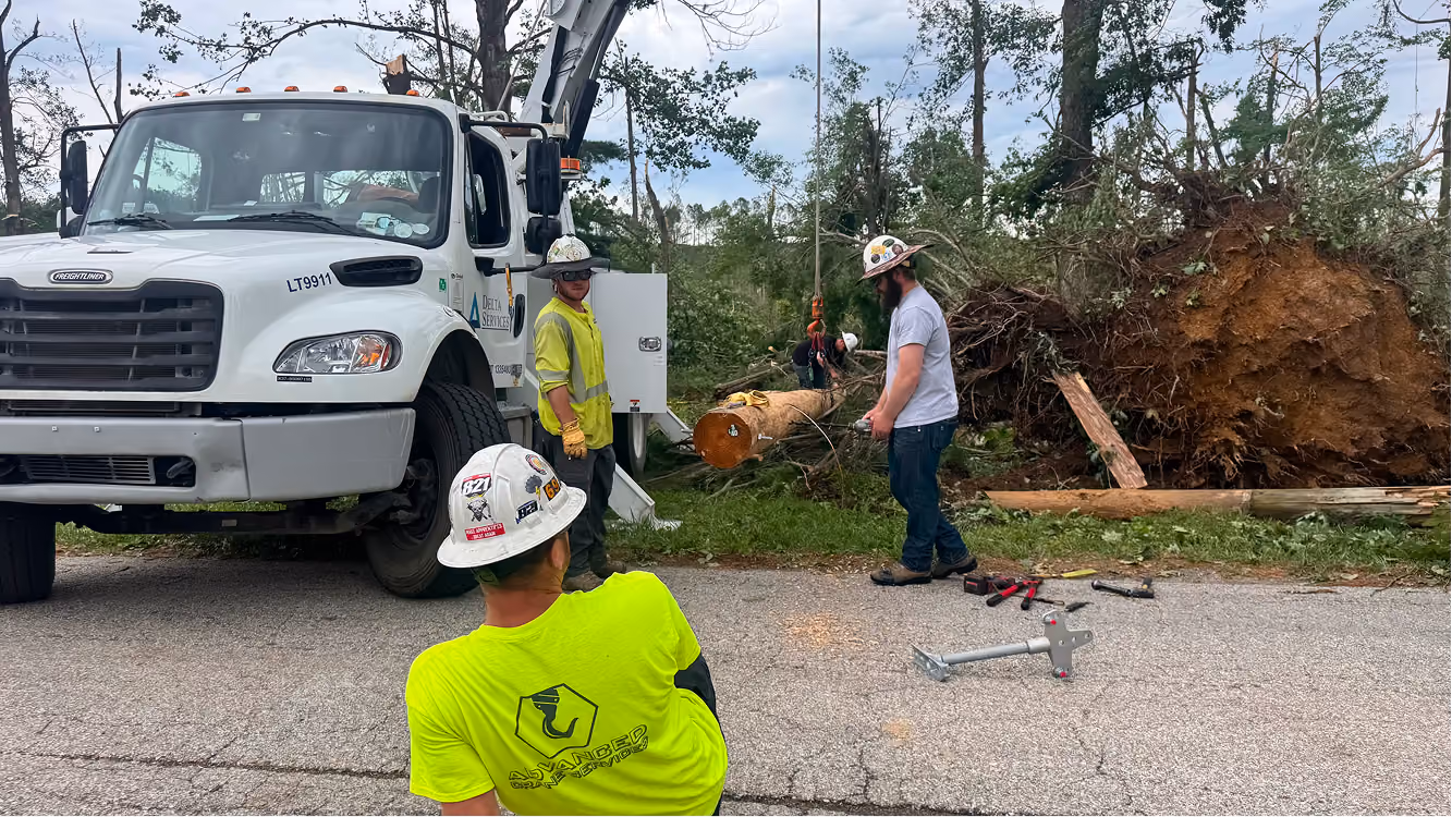 A crew works on the tornado damaged area on June 18 on Buskirk Road in rural Gosport. Several utility vehicles lined the street that afternoon. CHLOE ODEN | THE OWEN NEWS