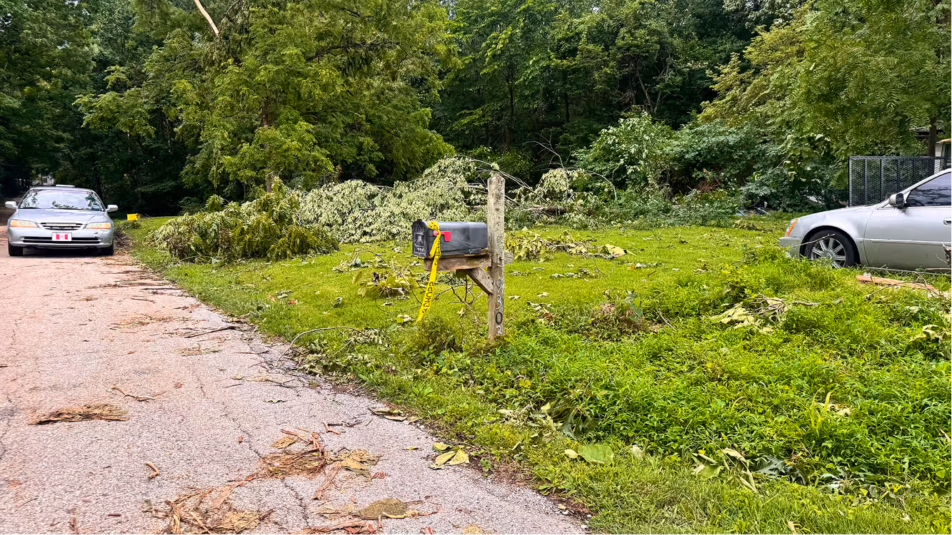 Caution tape is tied to a mailbox on June 18 on Buskirk Road in rural Gosport. A group from the American Regulators arrived on the street at around midnight after a tornado passed through the night before. CHLOE ODEN | THE OWEN NEWS