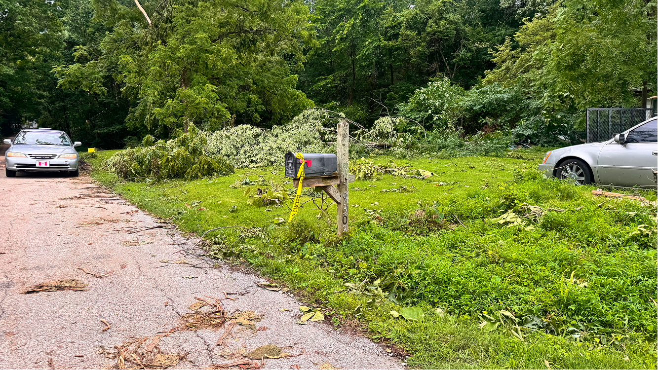 Caution tape is tied to a mailbox on June 18 on Buskirk Road in rural Gosport. A group from the American Regulators arrived on the street at around midnight after a tornado passed through the night before. CHLOE ODEN | THE OWEN NEWS