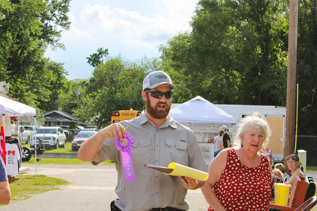 Josh Schonfeld announces the champion of the Kiddie Tractor Pull tournament of champions on July 10 at the Owen County Fairgrounds. CHLOE ODEN | THE OWEN NEWS
