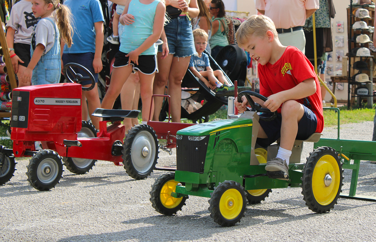 Colston Granger competes in the Kiddie Tractor Pull on July 10 outside the Exhibit Hall at the Owen County Fairgrounds. CHLOE ODEN | THE OWEN NEWS
