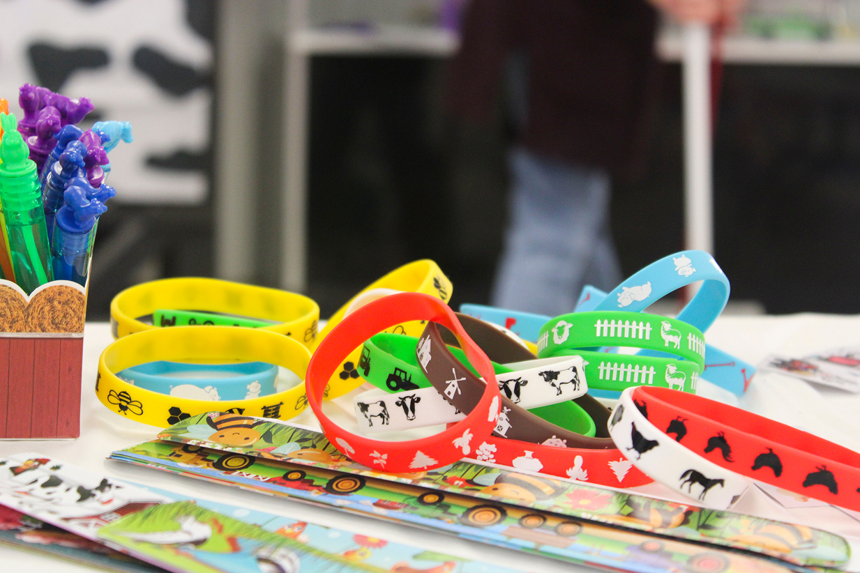 Rubber wristbands with farm animal designs lay on the table at the Book 2 Barn event on July 6, 2026, at the Owen County Fairgrounds.