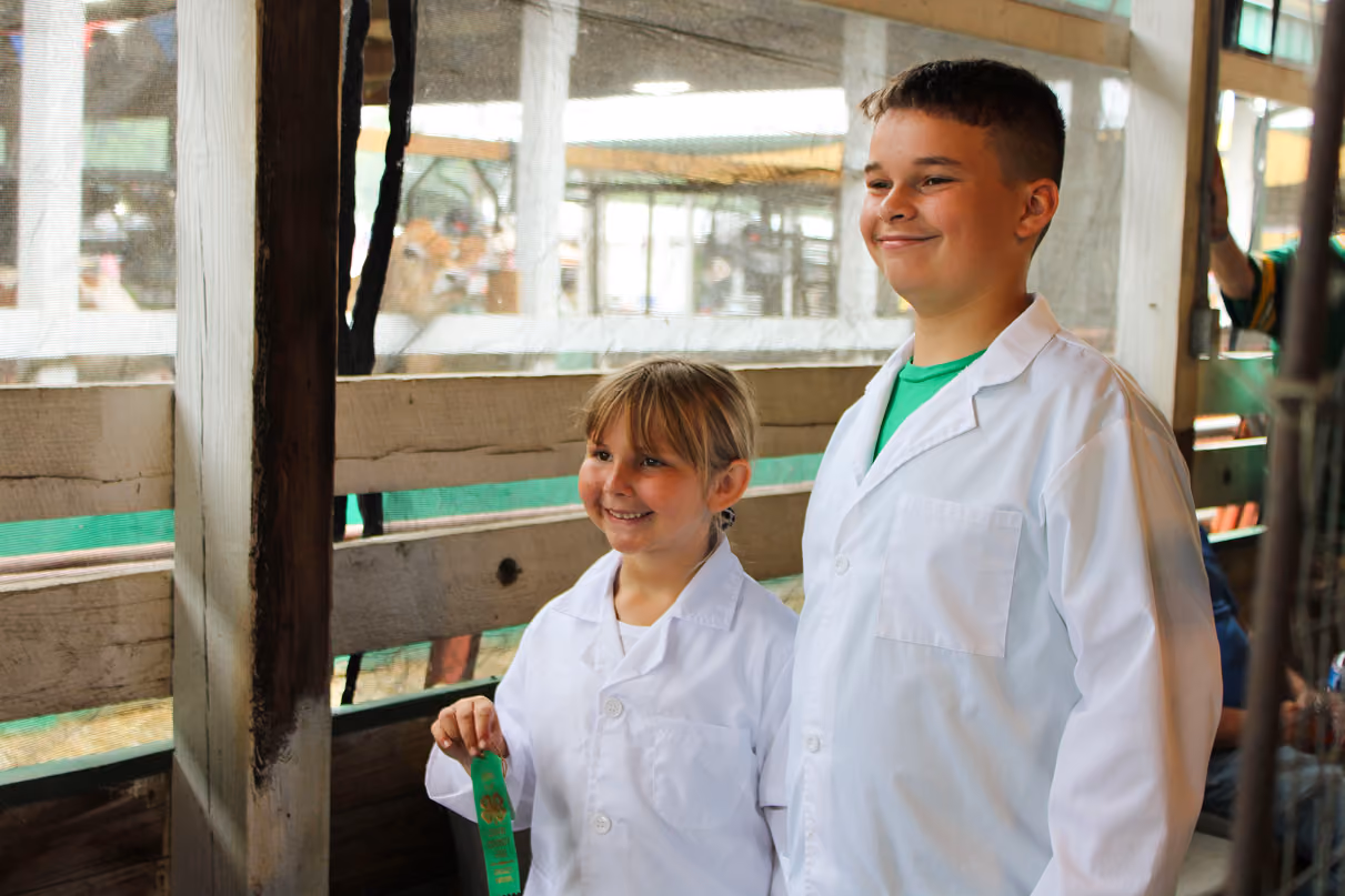 Reagan Hauser poses for a photo with Drew Jennings on July 6 at the Owen County Fairgrounds. Hauser was the champion of the Mini 4-H Rabbit Show. CHLOE ODEN | THE OWEN NEWS