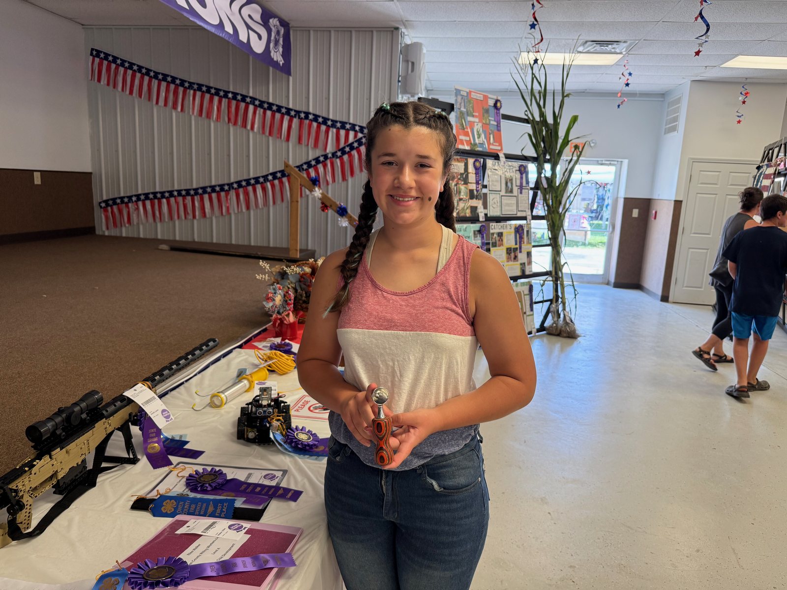 Woodworking Grand Champion Quinn Suitors poses for a photo with the winning project. NICOLE DECRISCIO | THE OWEN NEWS