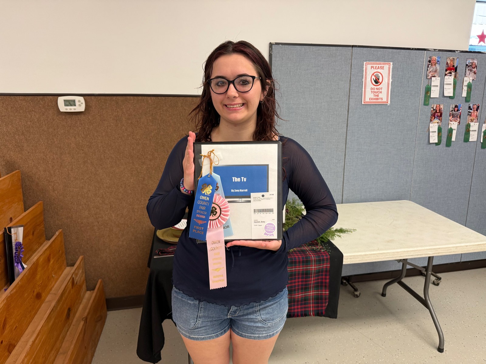 Creative Writing Reserve Grand Champion Zoey Harrell poses for a photo with her winning 4-H project. NICOLE DECRISCIO | THE OWEN NEWS