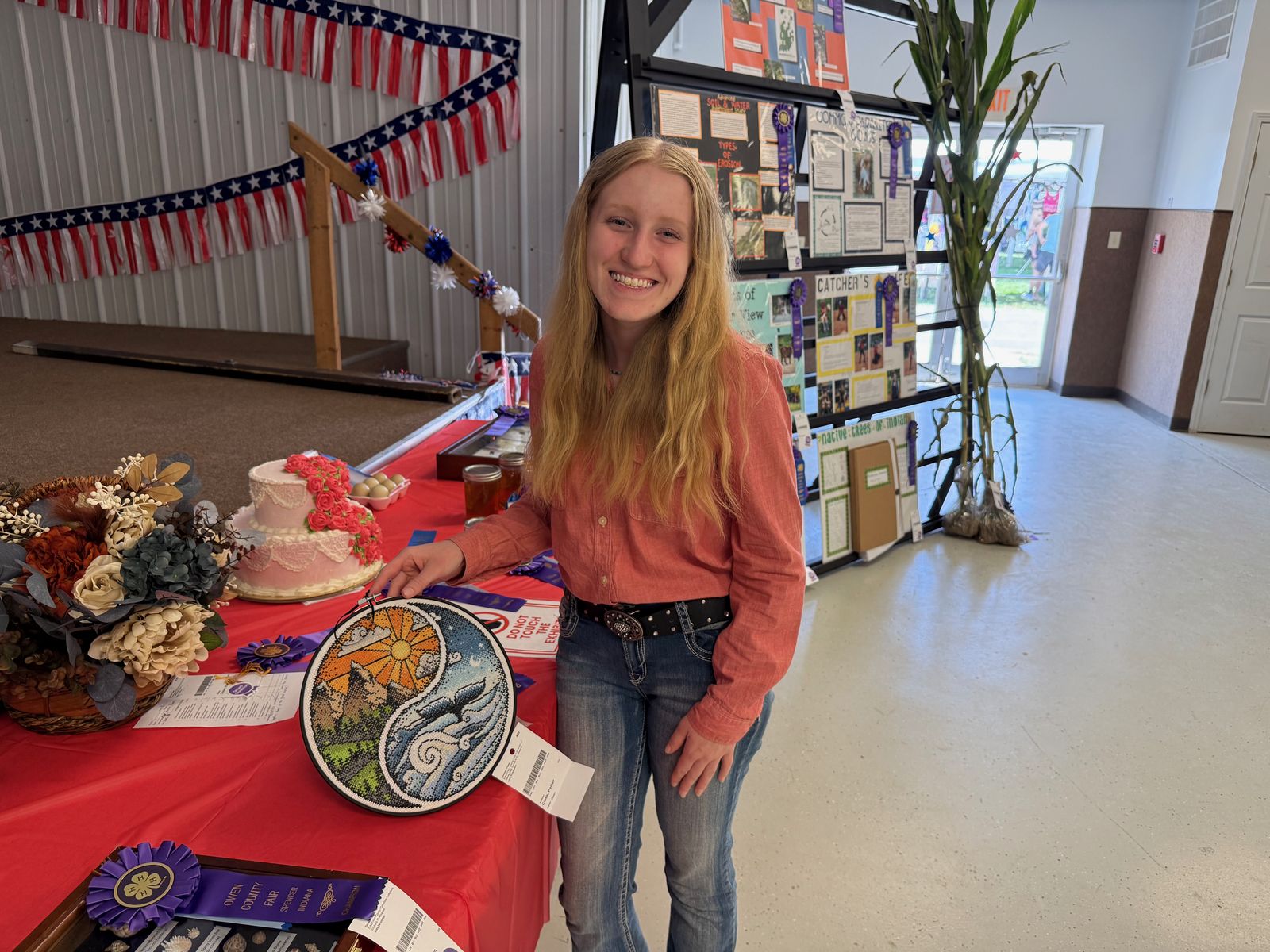 Parker Curtis poses with her needlecraft project. NICOLE DECRISCIO | THE OWEN NEWS