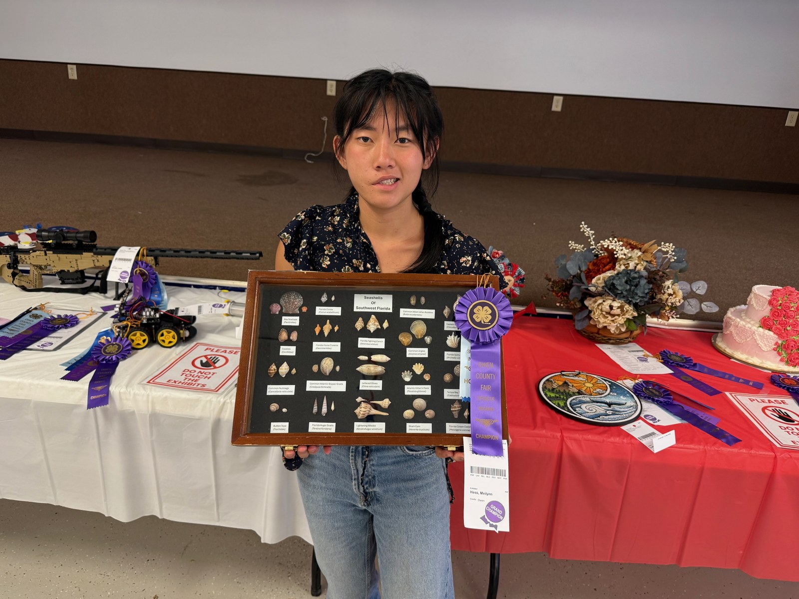 Grand Champion Meilynn Hess poses for a photo with her winning collection. NICOLE DECRISCIO | THE OWEN NEWS