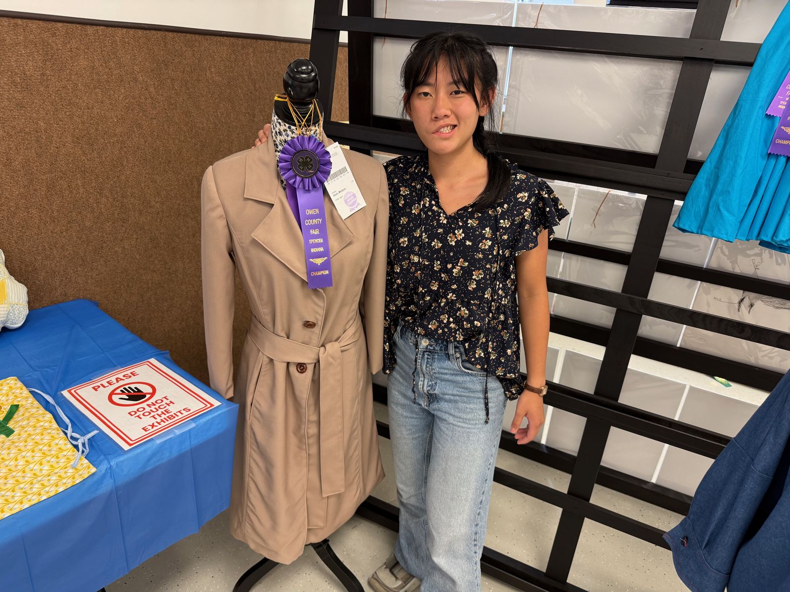 Fashion Review, Sewing Reserve Grand Champion Meilynn Hess poses for a photo with the winning project. NICOLE DECRISCIO | THE OWEN NEWS