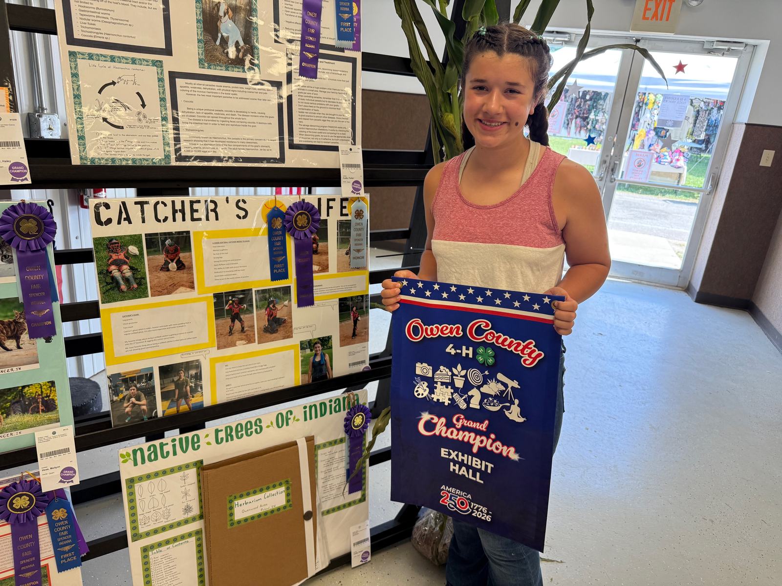 Quinn Suitors poses for a photo with the project that secured a Grand Champion win in Sports & Fitness. NICOLE DECRISCIO | THE OWEN NEWS