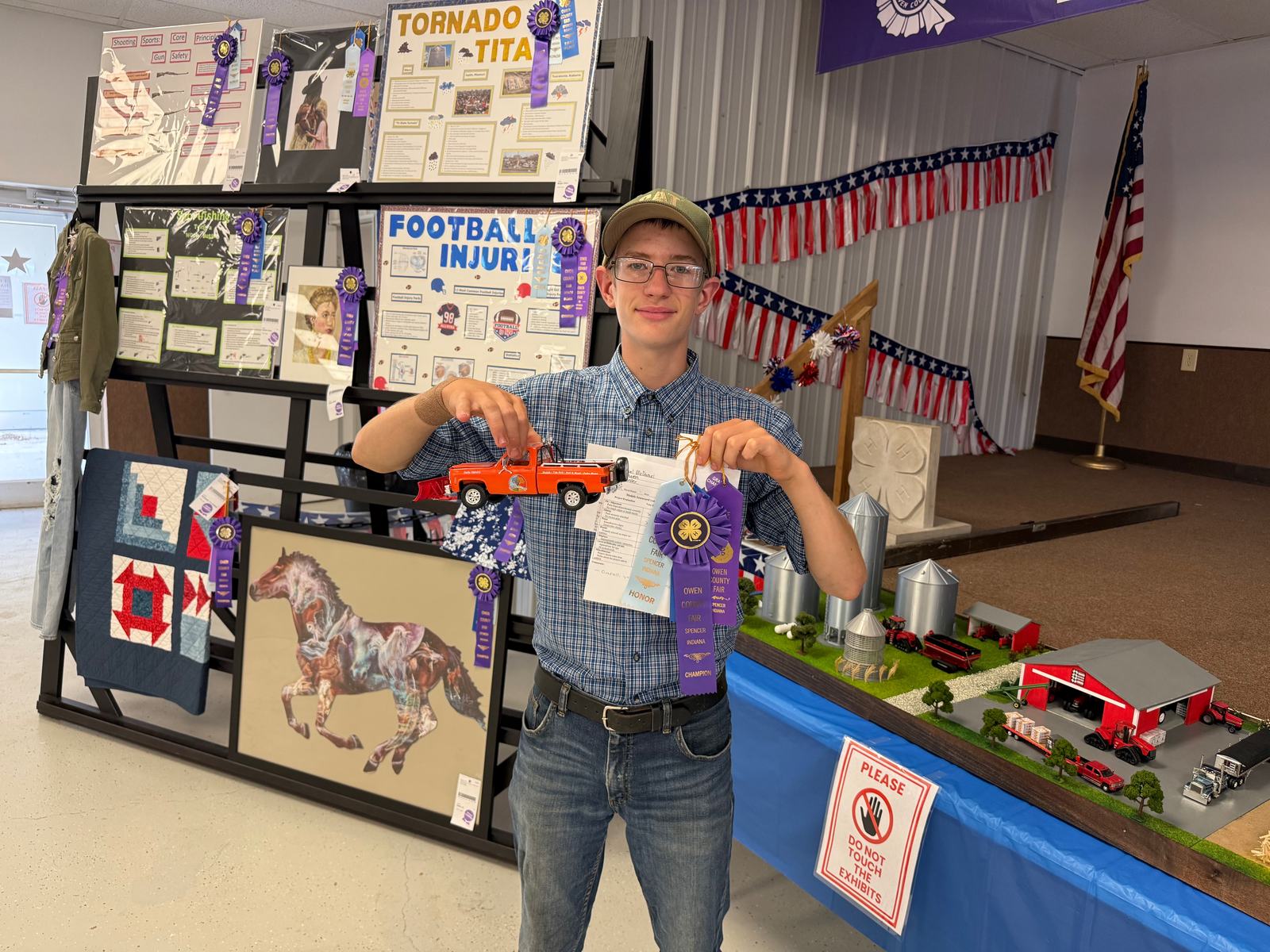 Model Craft Grand Champion Yisrael McDaniel poses for a photo with his winning 4-H project. NICOLE DECRISCIO | THE OWEN NEWS