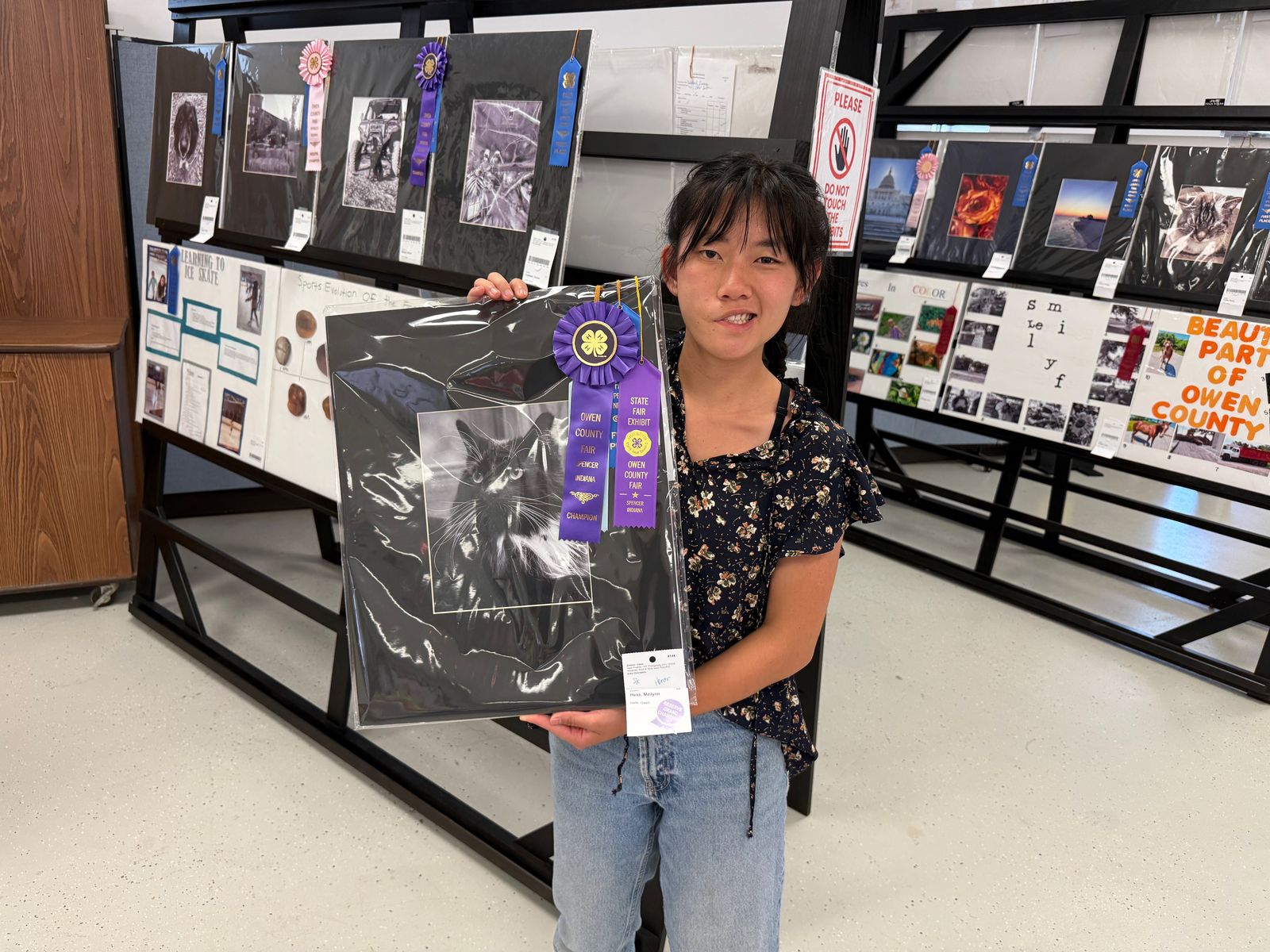Photography Reserve Grand Champion Meilynn Hess poses for a photo with the winning project. NICOLE DECRISCIO | THE OWEN NEWS