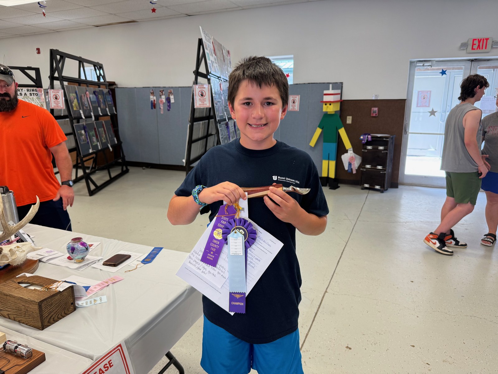 Reserve Grand Champion in Woodworking, Knox Suitors, poses for a photo with the winning project. NICOLE DECRISCIO | THE OWEN NEWS