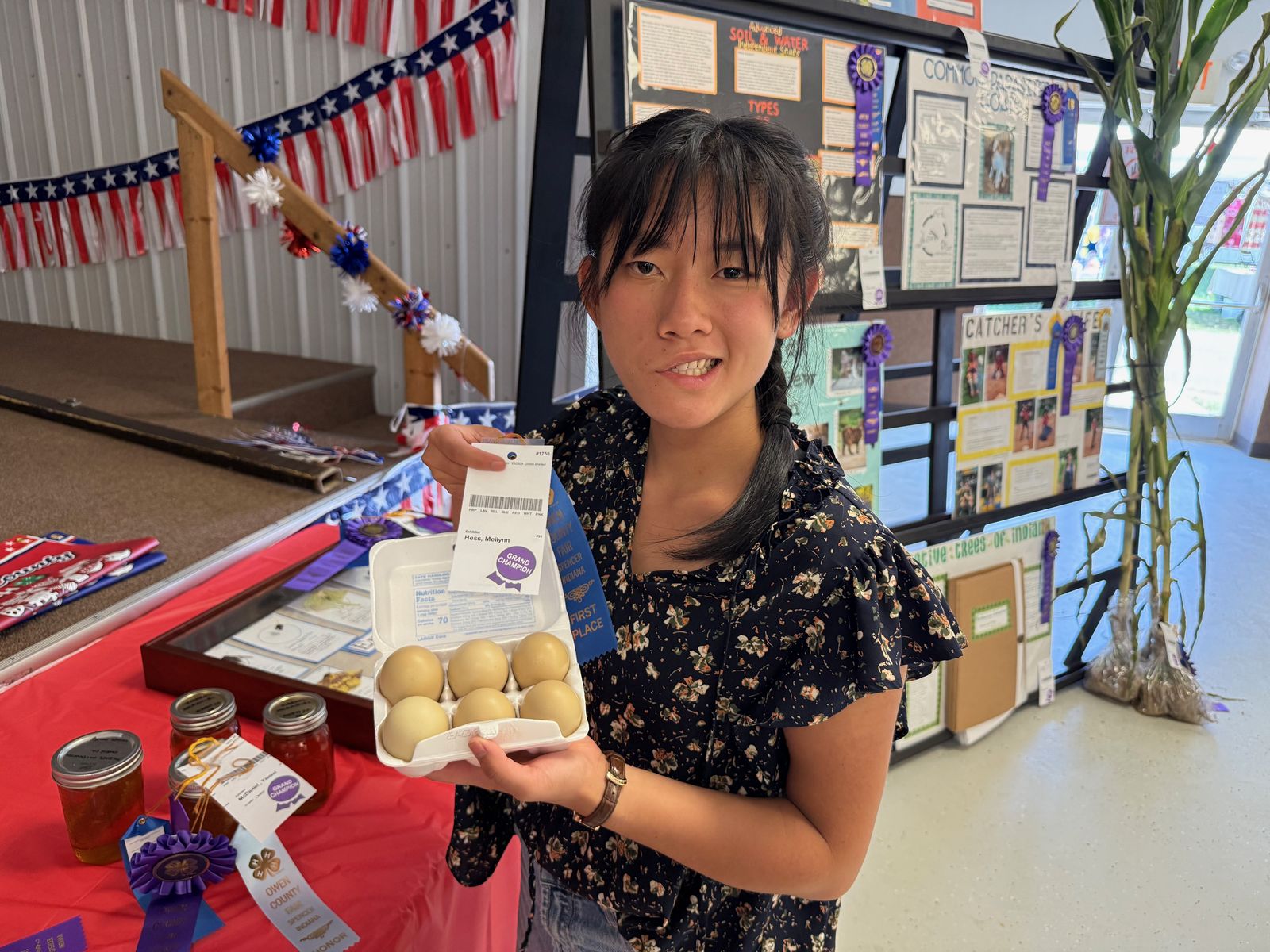 Grand Champion Meilynn Hess poses for a photo with her winning Green Shelled Eggs. NICOLE DECRISCIO | THE OWEN NEWS