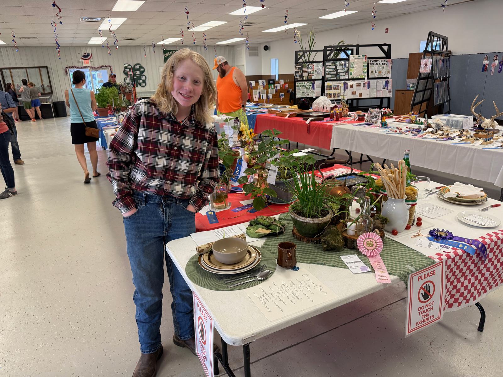 Reserve Grand Champion Wyatt Curtis poses for a photo with his table presentation project. NICOLE DECRISCIO | THE OWEN NEWS