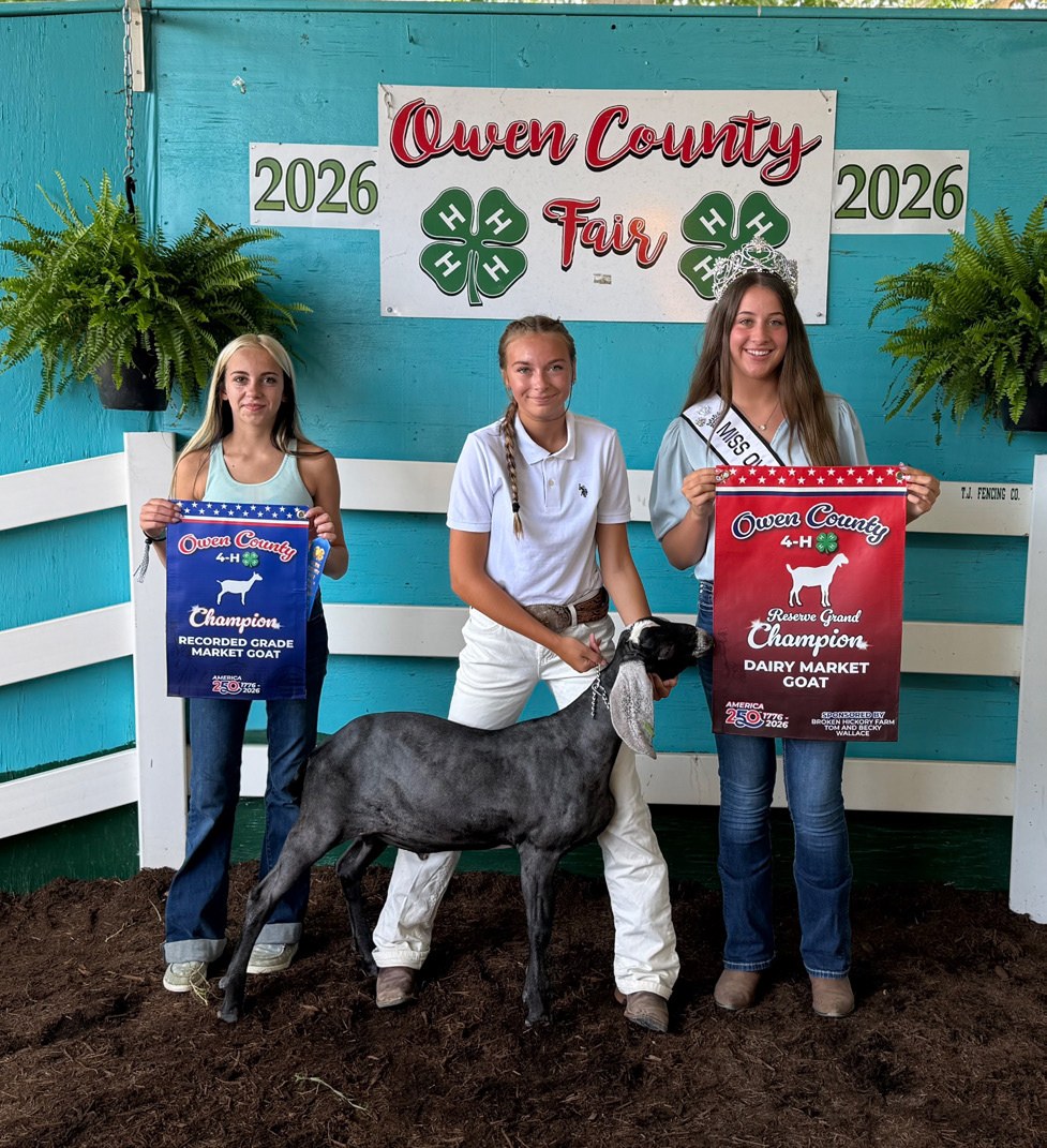 Josey Mobley (center) earned Dairy Market Goat Reserve Grand Champion and Champion Recorded Grade Market Goat honors at the 2026 Owen County Fair. Also pictured are Akaydia Beckwith and 2026 Owen County Fair Princess Makynlie Hall. NICOLE DECRISCIO | THE O