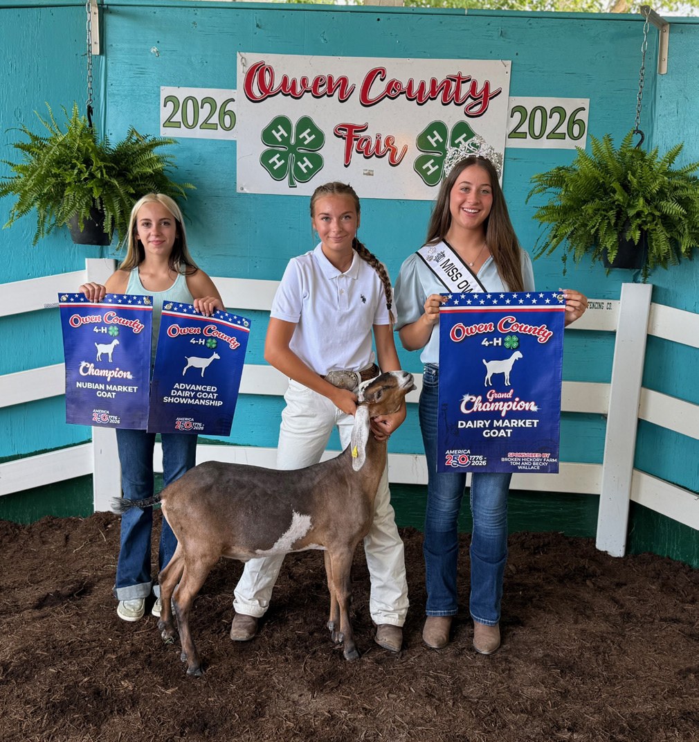 Josey Mobley (center) earned Grand Champion Dairy Market Goat, Champion Nubian Market Goat, and Advanced Dairy Goat Showmanship honors at the 2026 Owen County Fair Dairy Goat Show in the Main Arena. Also pictured are Akaydia Beckwith and 2026 Owen County F