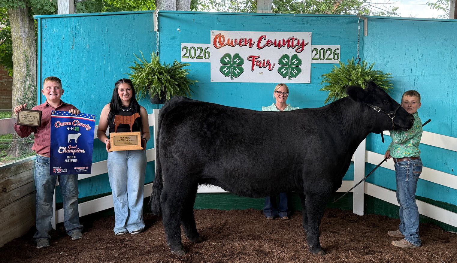 Hudson Rice poses for a photo in celebration of his Grand Champion Beef Heifer at the 2026 Owen County Fair. NICOLE DECRISCIO | THE OWEN NEWS