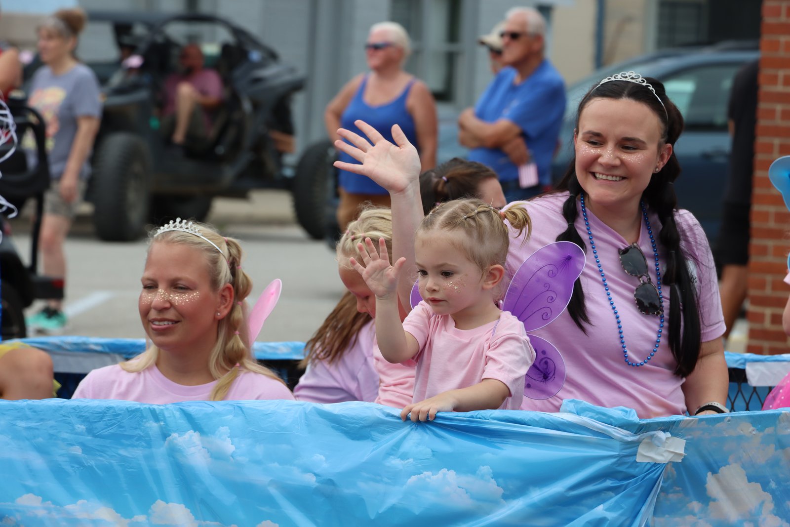 Mother-daughter duo Dr. Lexie Heck-Britton and Eloise Britton throw candy from their “Best Overall” award-winning, tooth fairy themed float fielded by Gosport Dental Clinic. SUBMITTED PHOTO