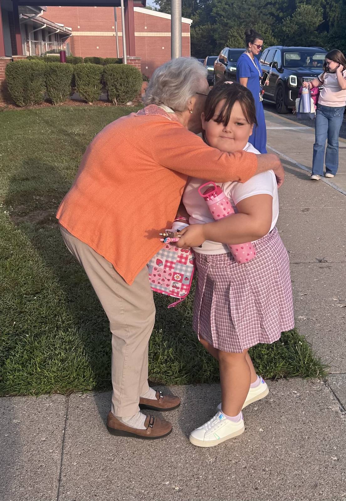 GES librarian Lynn Anderson welcomes back third grader Jupiter Bishop. Jupiter is daughter of Blain Bishop and Jessica Shields. SUBMITTED PHOTO