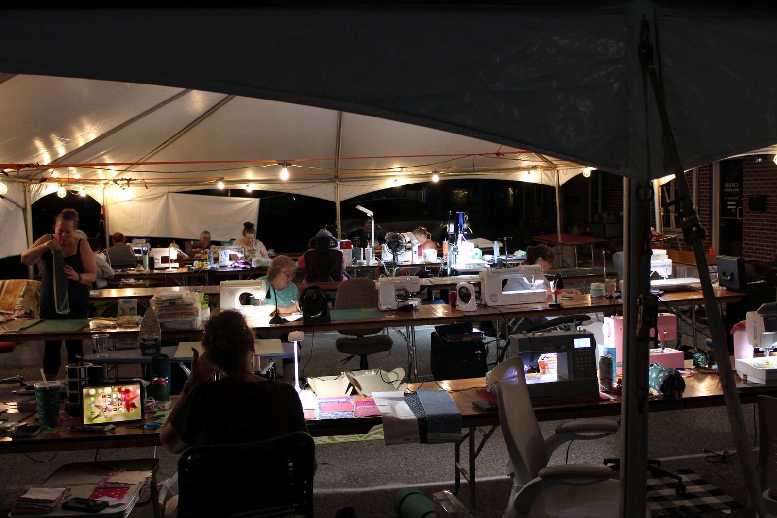 By 10:30 that night, only a few people are still left quilting compared to the 32 people that started at 10:00am that morning. TYLER DEFORD