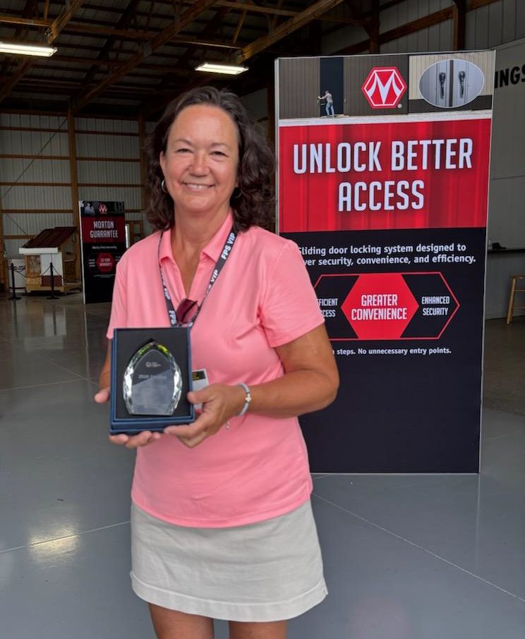 Doris Scully poses with her trophy at the Farm Progress Show in Iowa. SUBMITTED PHOTO|DAVE SCULLY