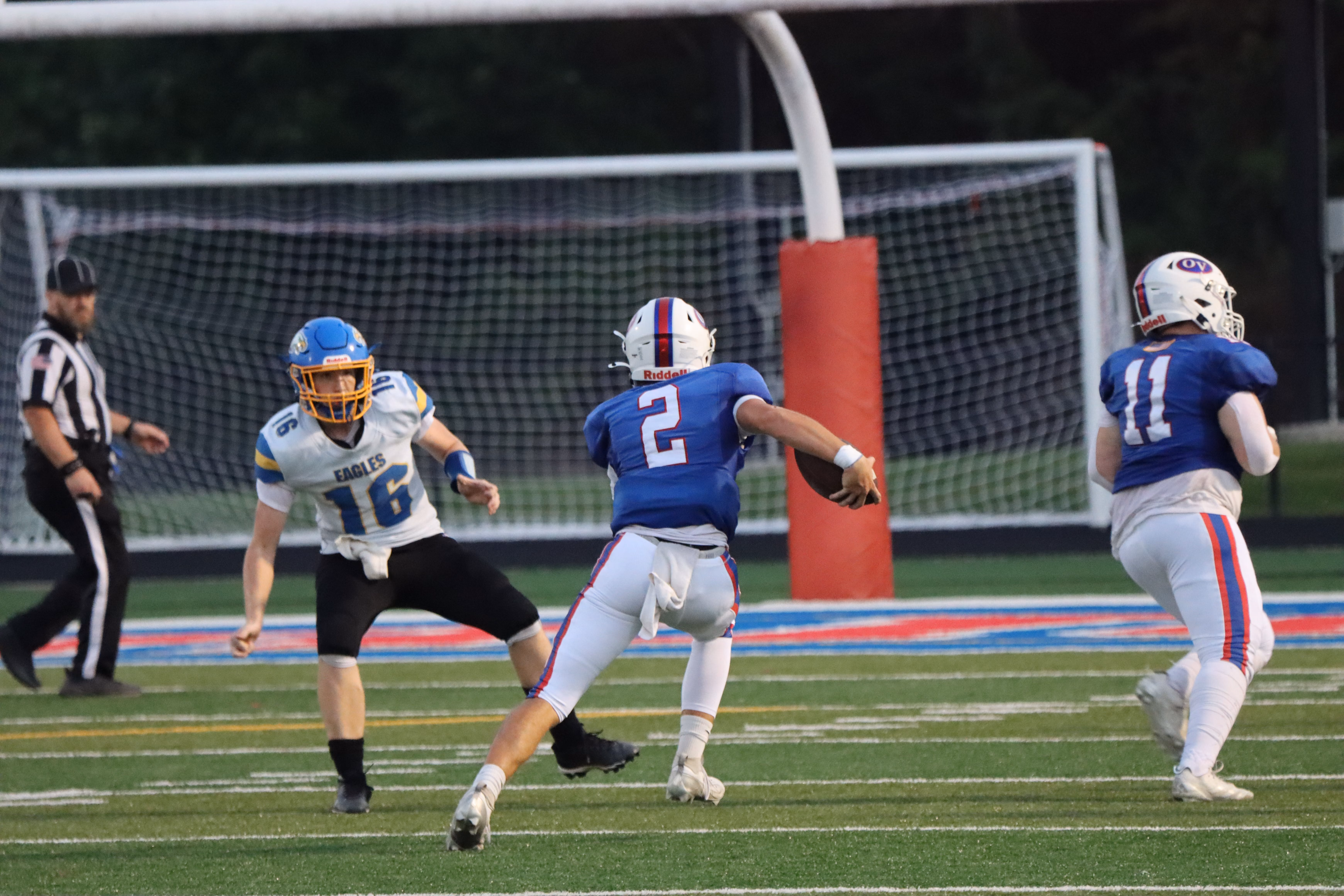 Parker Phillipe (#2) slips past the Eagles’ #16 while Jaxon Dill (#11) sets up a block. Phillipe had an odd opening game with just two pass attempts for two total yards. A 35-yard rushing touchdown accounted for the rest of his offensive output in a night dominated by running plays. SUBMITTED PHOTO | AARON LAGRANGE