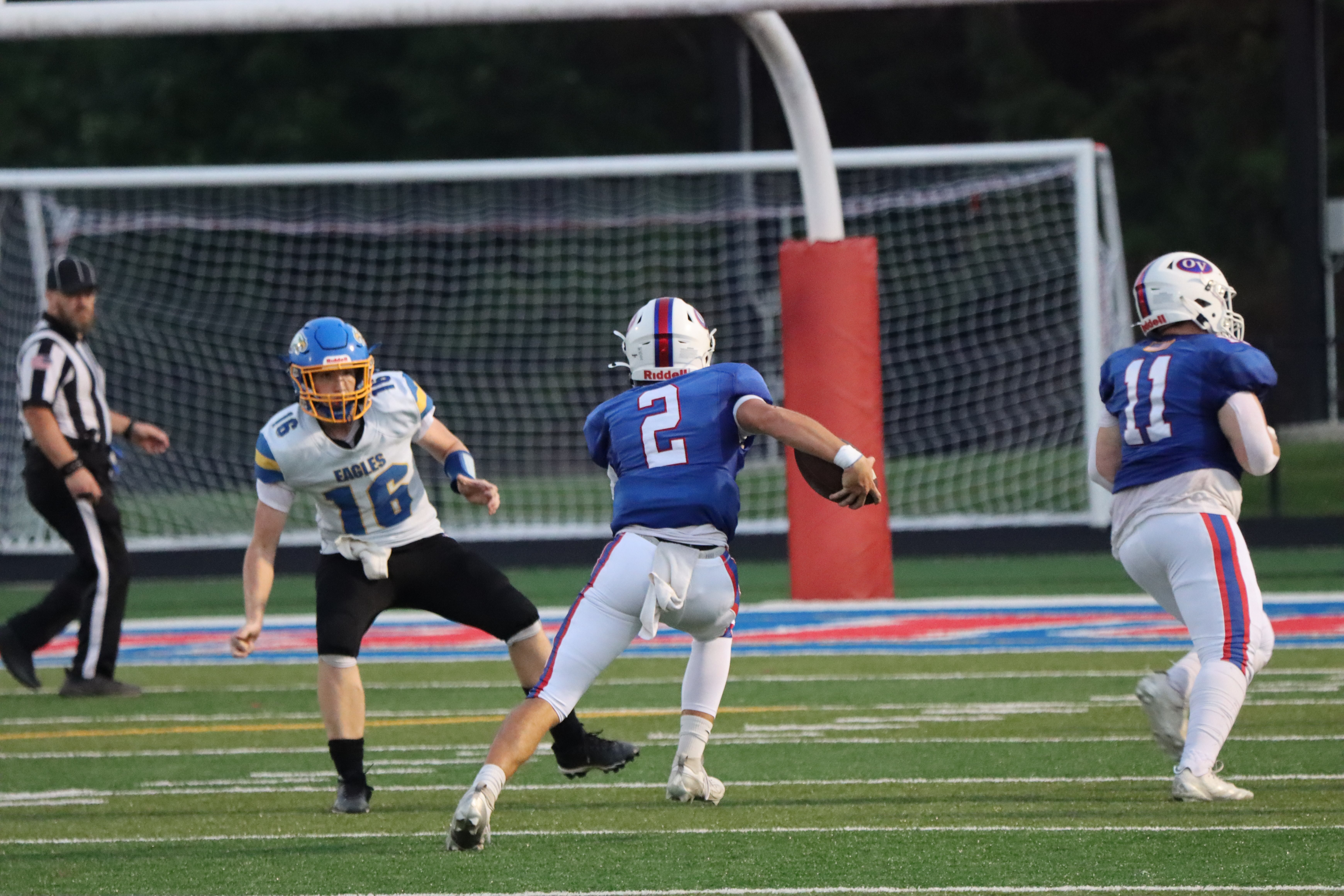 Parker Phillipe (#2) slips past the Eagles’ #16 while Jaxon Dill (#11) sets up a block. Phillipe had an odd opening game with just two pass attempts for two total yards. A 35-yard rushing touchdown accounted for the rest of his offensive output in a night dominated by running plays. SUBMITTED PHOTO | AARON LAGRANGE