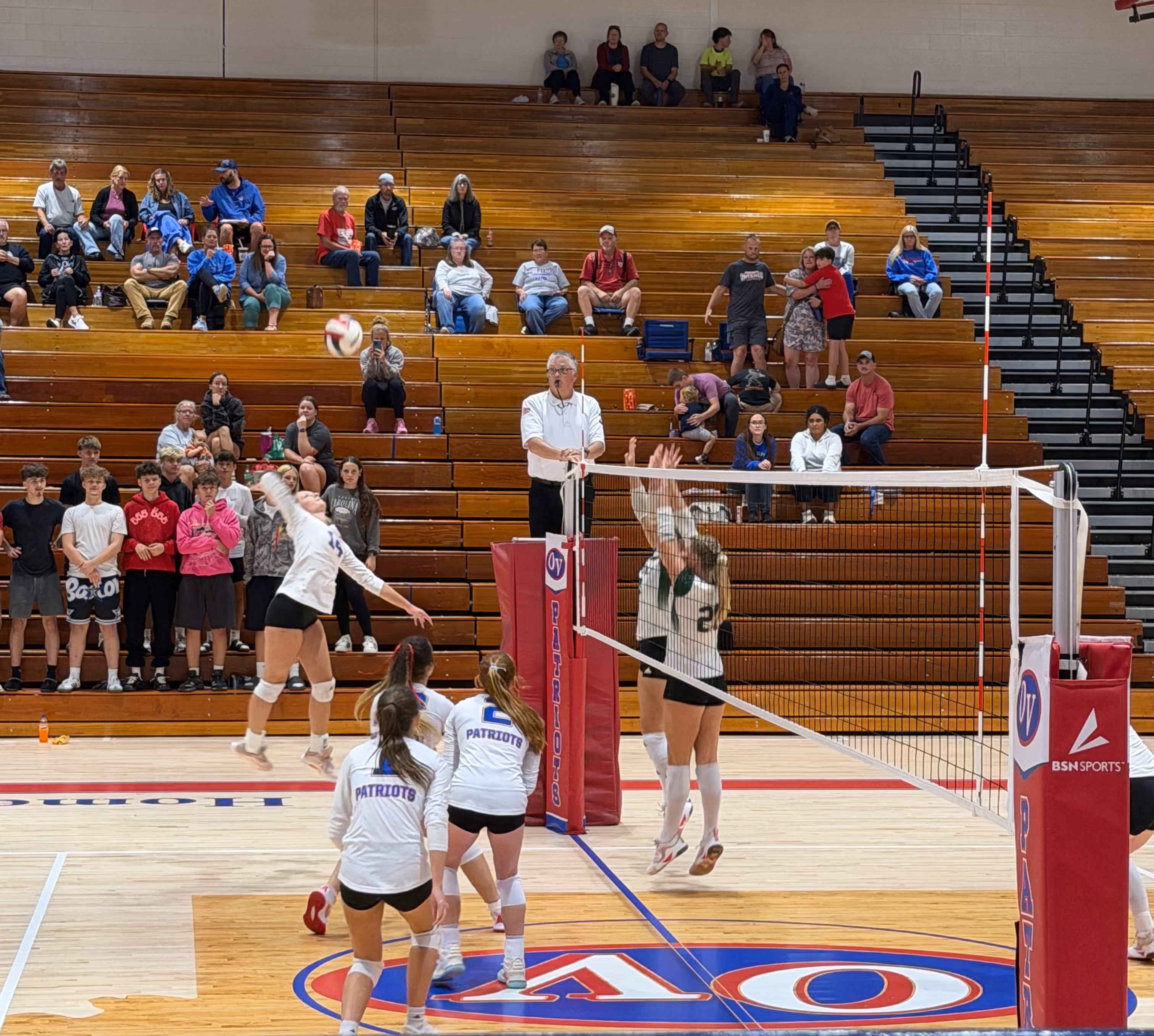 Vincennes Lincoln defenders guard the net as Owen Valley senior Abree Wells spikes the ball at the Aug. 24 home game against the Alices. STAFF PHOTO | THE OWEN NEWS