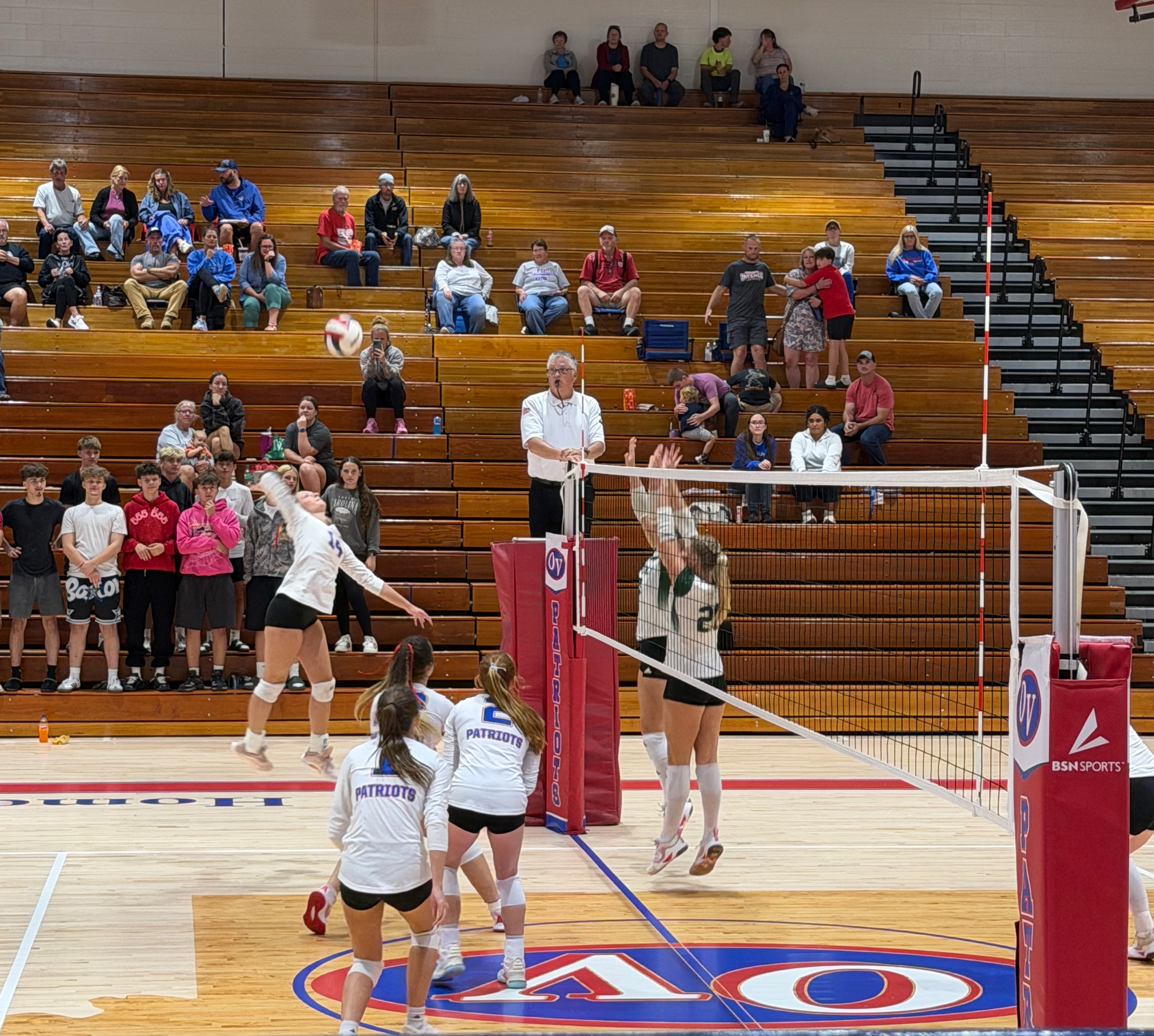 Vincennes Lincoln defenders guard the net as Owen Valley senior Abree Wells spikes the ball at the Aug. 24 home game against the Alices. STAFF PHOTO | THE OWEN NEWS
