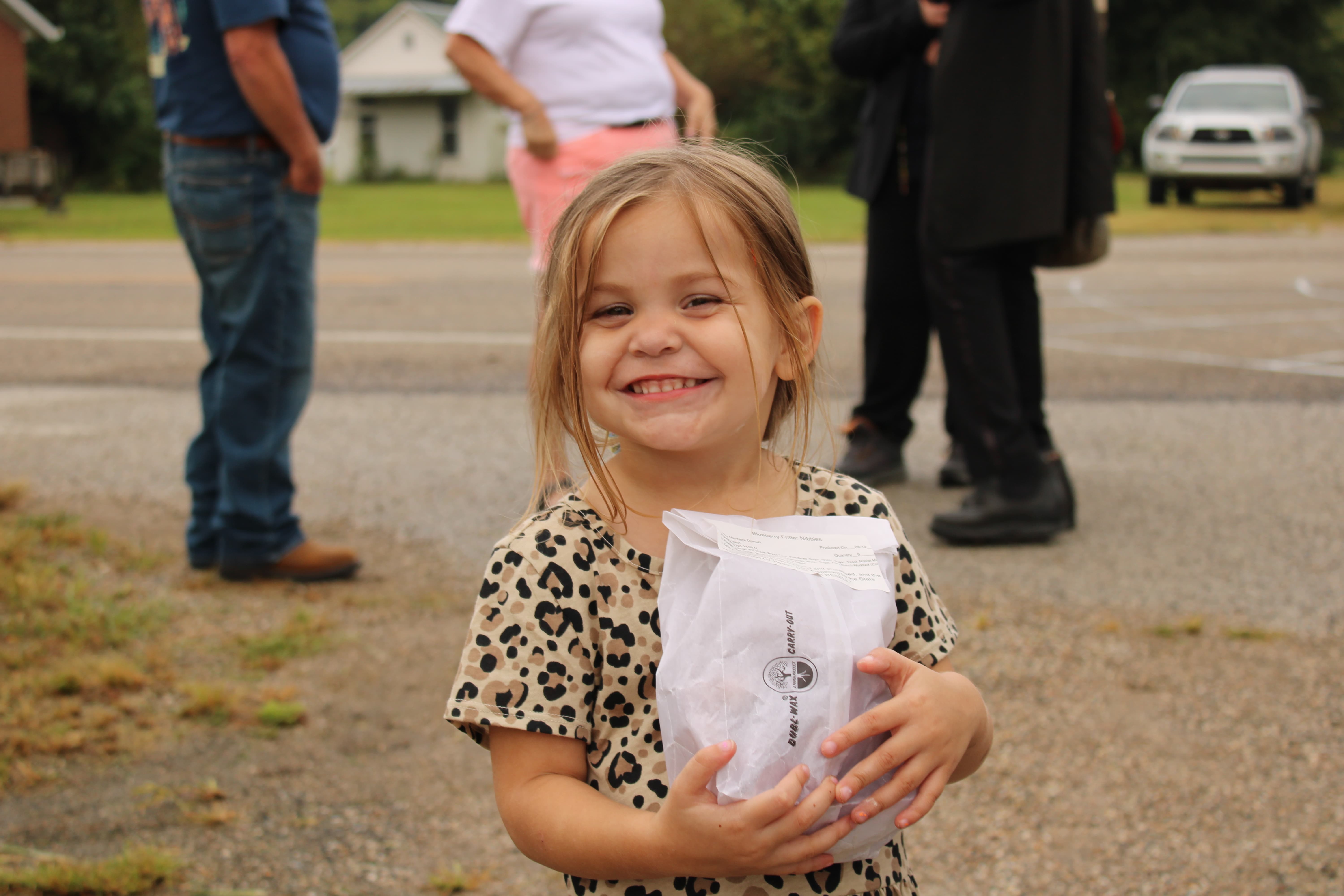 Siblings Waylon and Oakley Conley each won the cake walk and proudly display their prizes. STAFF PHOTO | THE OWEN NEWS