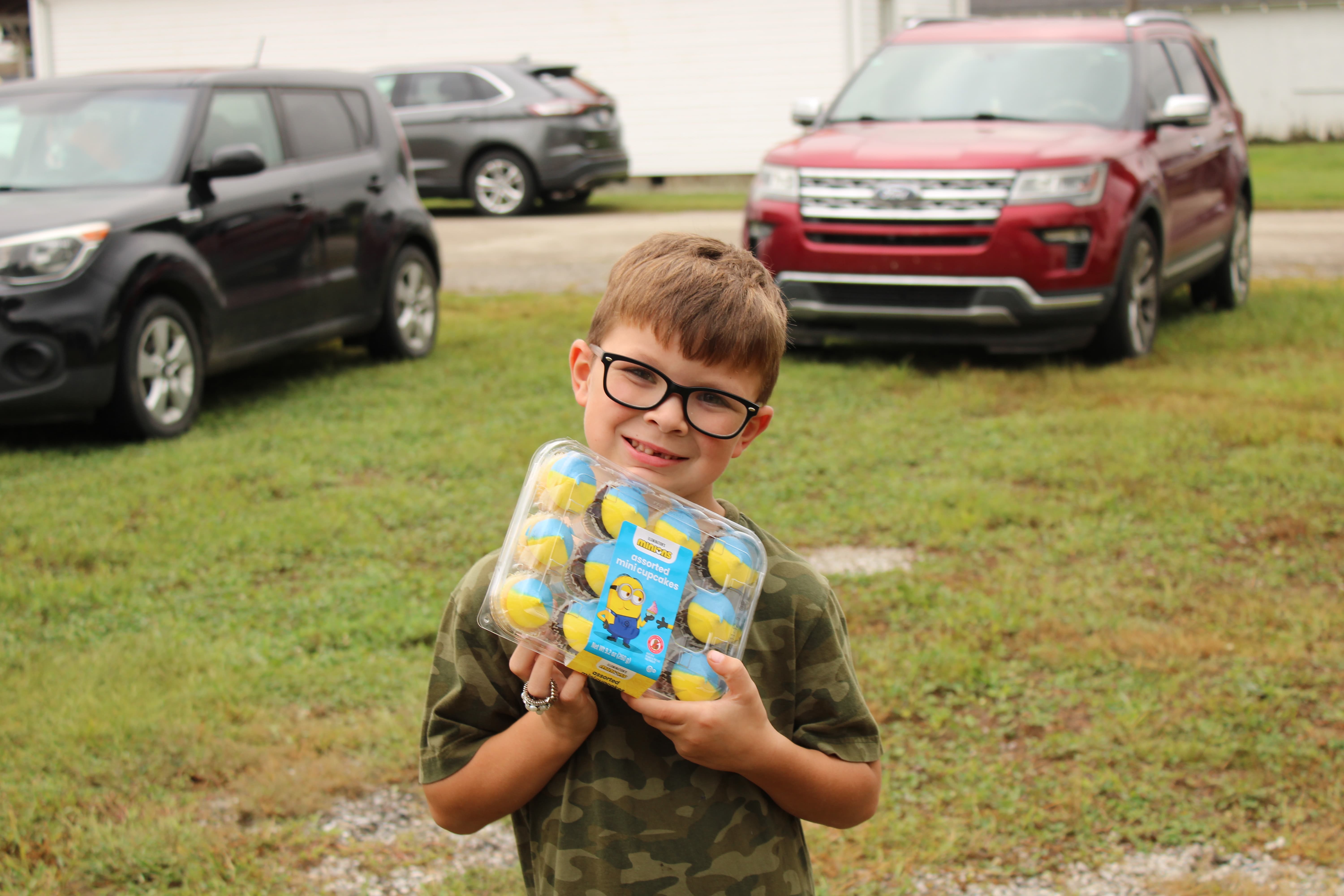 Siblings Waylon and Oakley Conley each won the cake walk and proudly display their prizes. STAFF PHOTO | THE OWEN NEWS