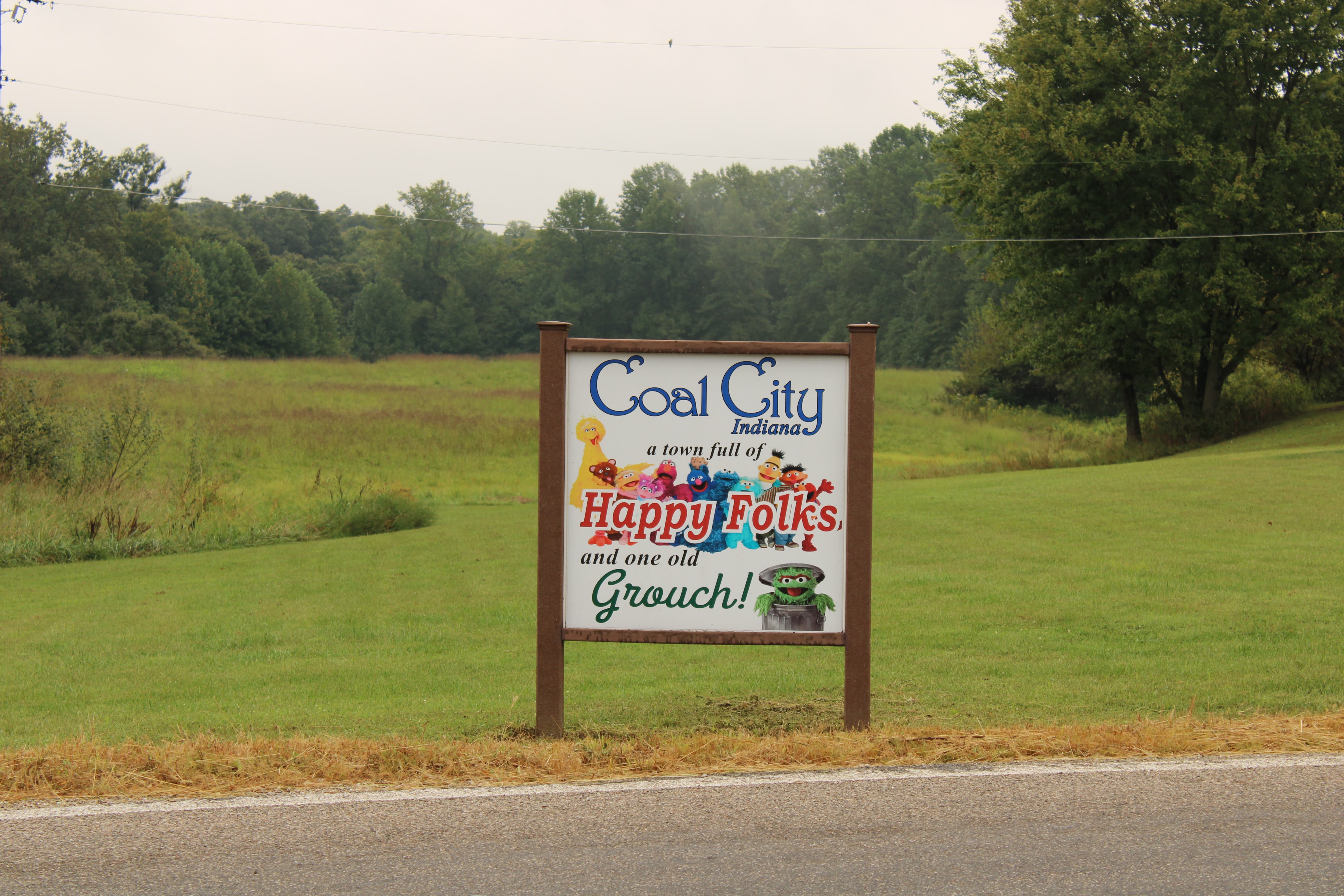 In 1975, the first Old Grouch sign appeared in Coal City. It read, ‘Coal City, Population 162 and 1 Old Grouch’. The subsequent sign that stood for years showed happy faces, with one red face (the Old Grouch). The image above reflects the newly upgraded sign posted on the edge of town. STAFF PHOTO | THE OWEN NEWS