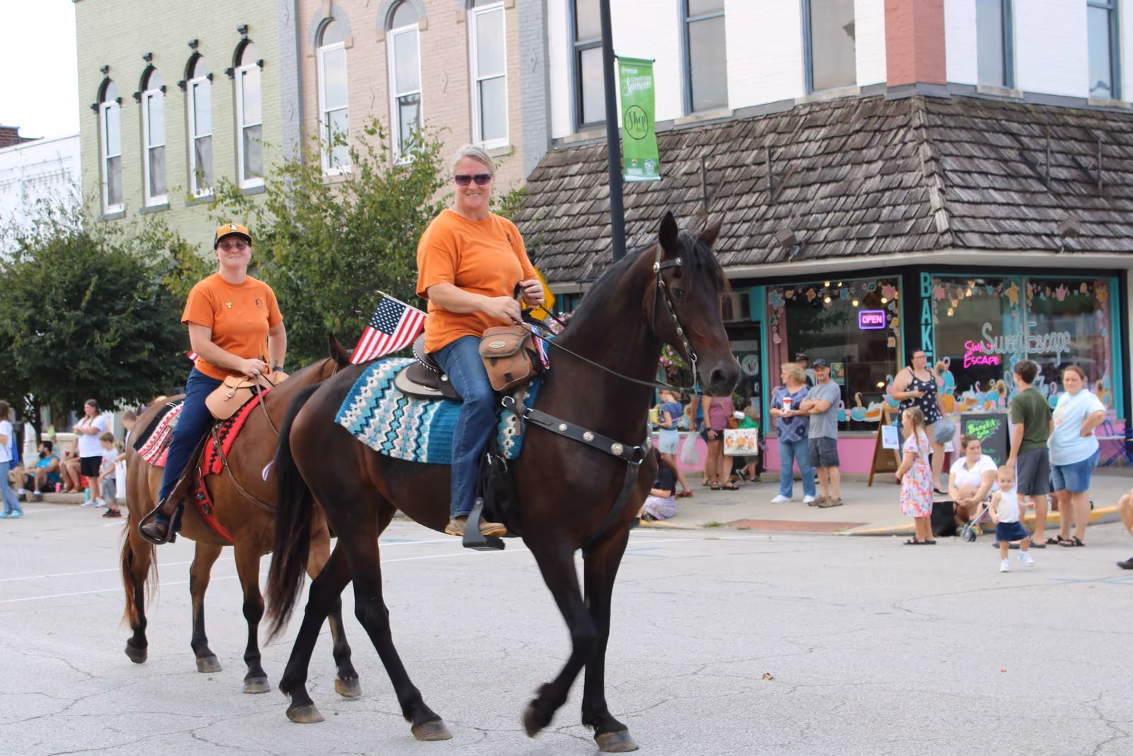 Representatives from M & M Horse Rescue and their equine rescues walk in the Apple Butter Festival Parade (and leave a few reminders behind). STELLA KLAUS | INDIANA NEWSROOM
