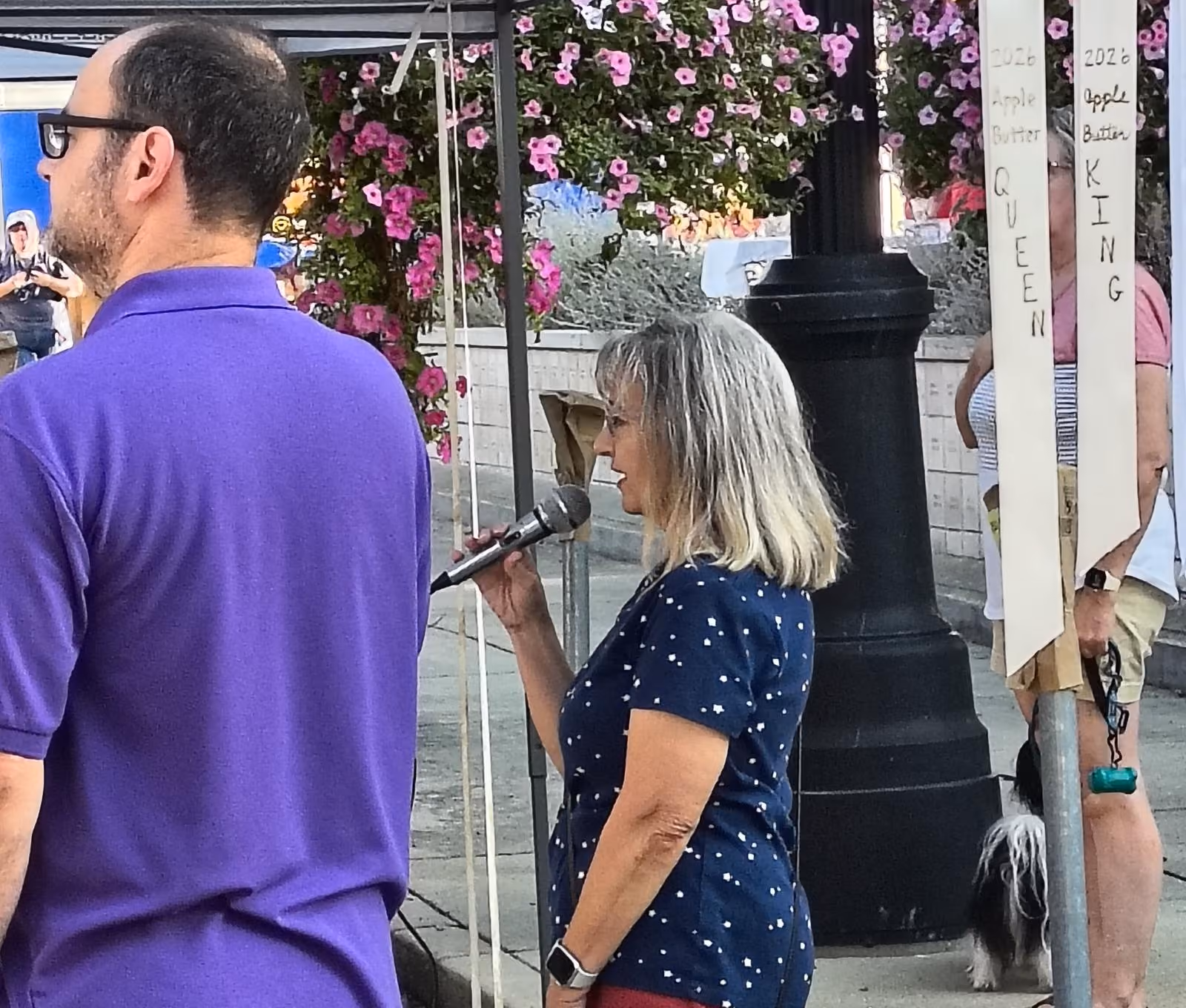 Spencer resident Michelle DeFord opens the Apple Butter festival with her rendition of the Star Spangled Banner, sung over the loudspeaker mounted on top of the courthouse. TYLER DEFORD | THE OWEN NEWS