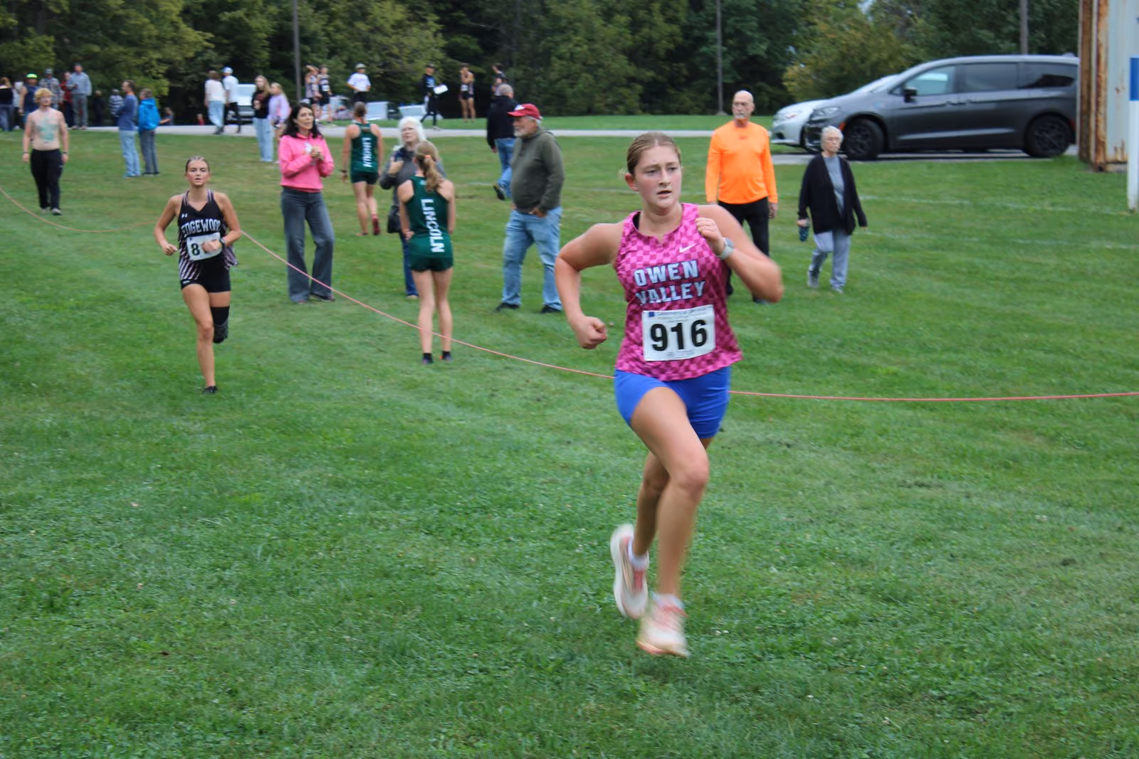 Kendall Freeman barrels down the final straightaway with an Edgewood runner hot on her heels. Freeman finished 31st with a time of 25:16. TYLER DEFORD | THE OWEN NEWS