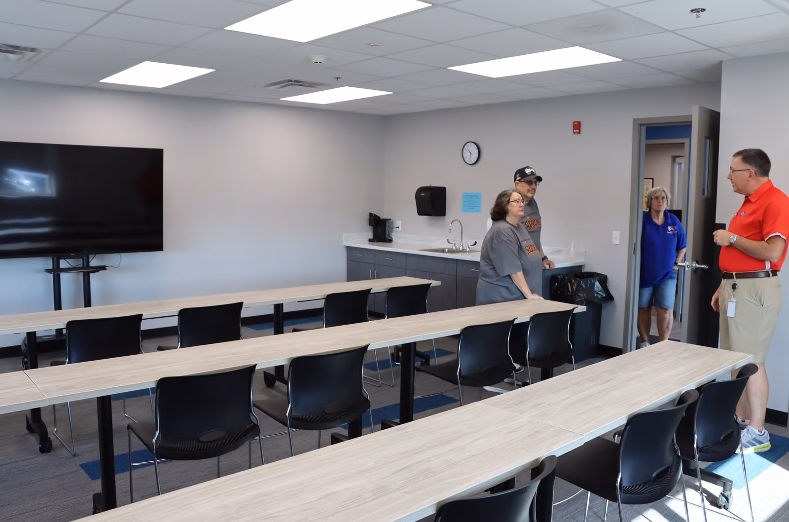 Visitors tour the driver meeting and training conference room during the open house for the new S-OCS Transportation Center. SUBMITTED PHOTO | AARON LAGRANGE