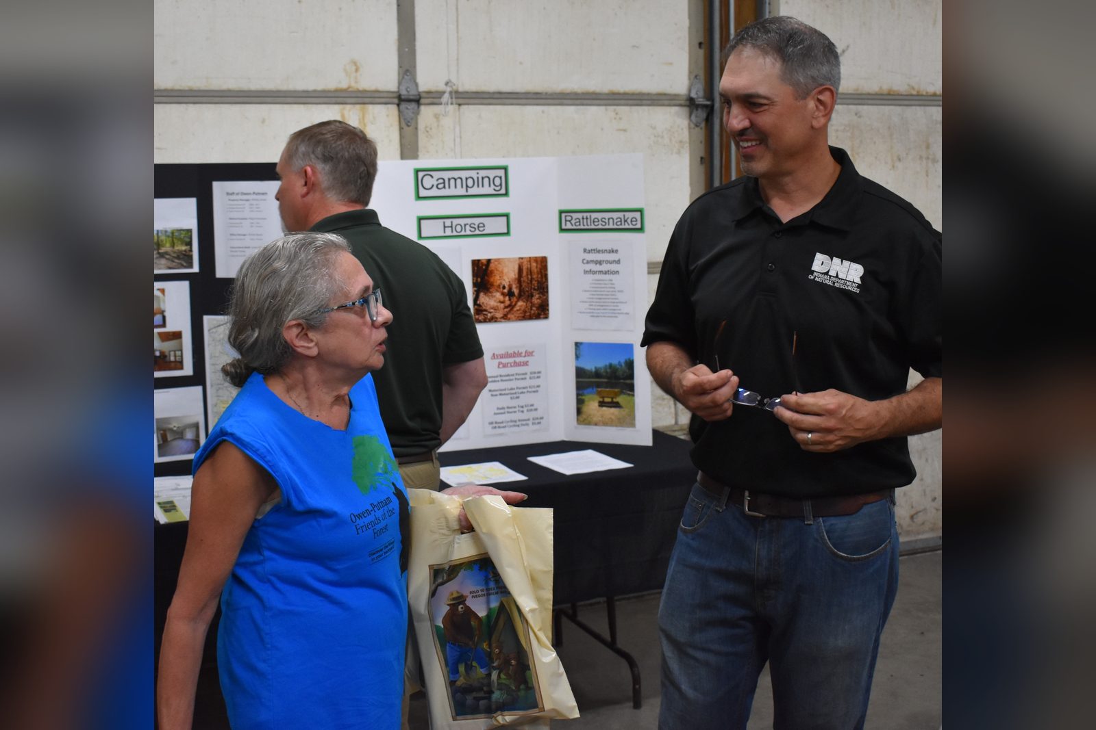 Owen-Putnam State Forest (OPSF) Property Manager Phillip Jones speaks with Pam Patterson of Poland, IN, a member of the Friends of the Owen-Putnam State Forest, during the property’s annual open house held Oct. 1. TRAVIS CURRY | THE OWEN NEWS