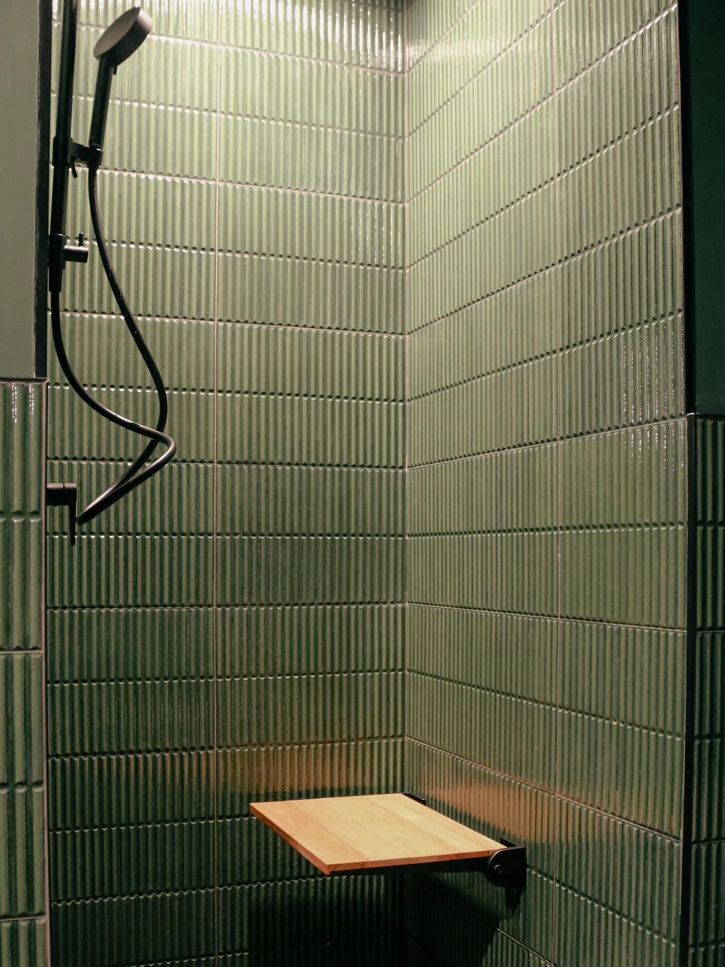 Showers inside locker room of forth yoga studio