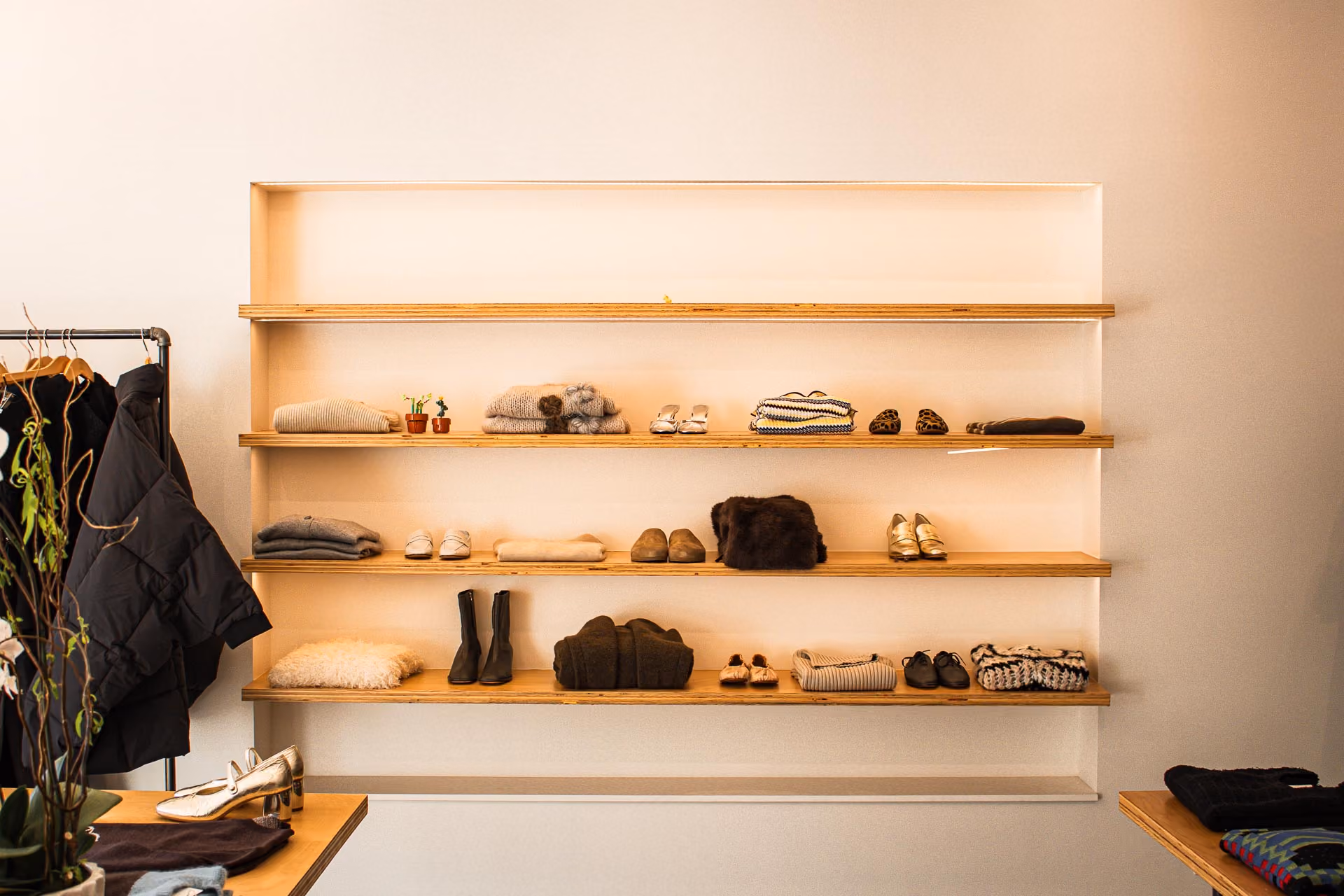FELT Chicago recessed wall shelves displaying shoes, sweaters and accessories