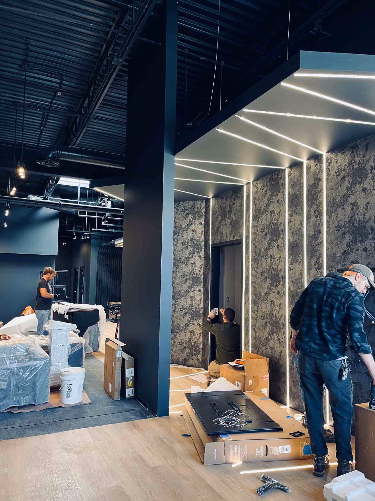Klasik Construction crew finishing the treatment area build-out at Adjusted Health + Performance