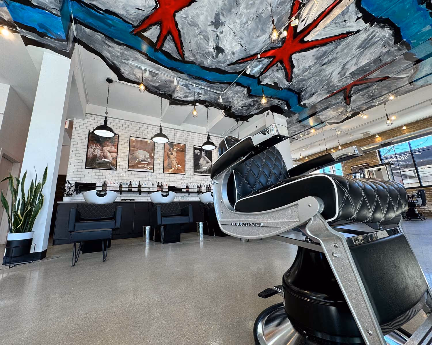 Rev. Billy's Chop Shop barber chair beneath the Chicago-flag ceiling mural