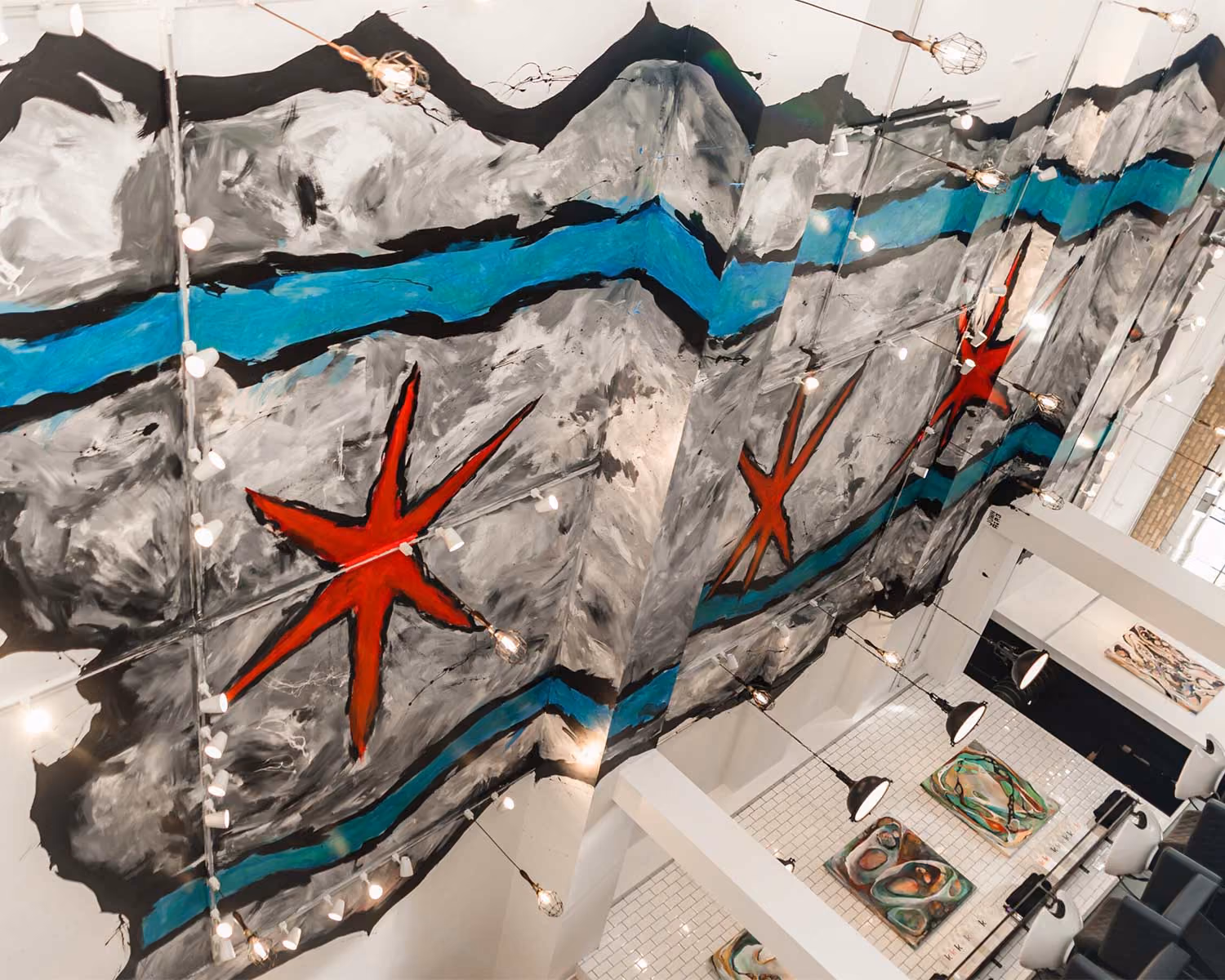Close-up of the Chicago-flag mural painted across the Rev. Billy's Chop Shop ceiling