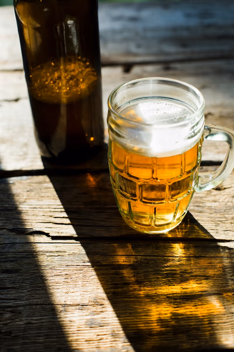 Glass mug of beer on table