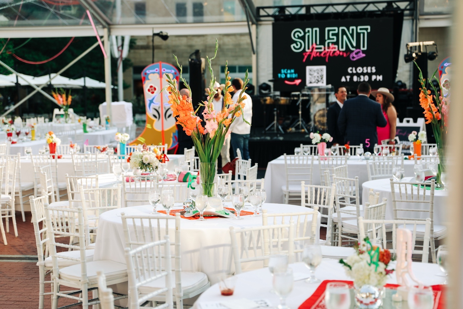 Guests and set tables at a Magdalena’s catered event