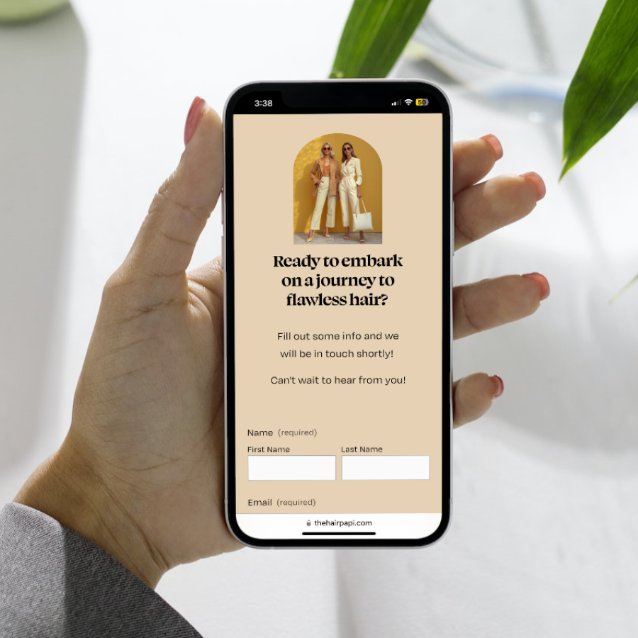 Hand holding a smartphone displaying a form titled 'Ready to embark on a journey to flawless hair?' with fields for first name, last name, and email.