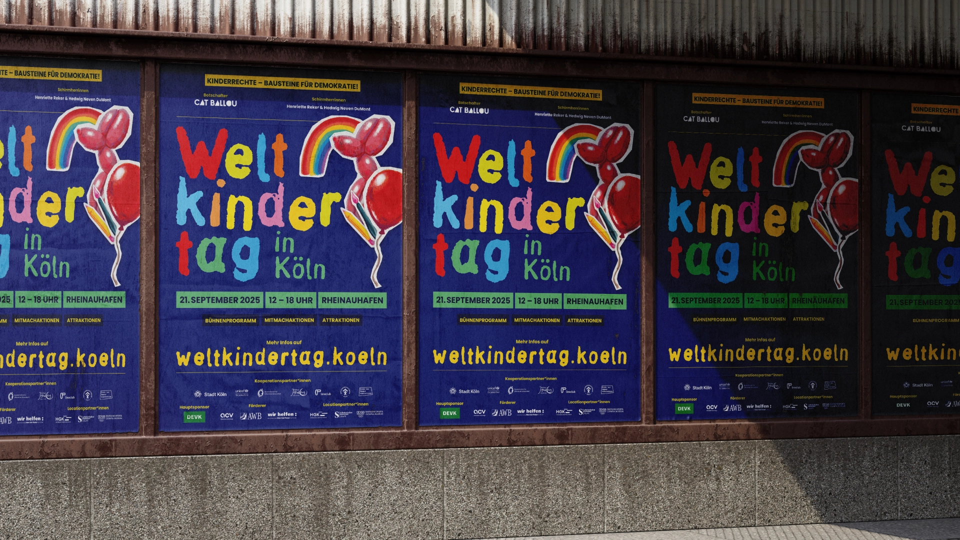 Five Posters on a wall in the city.