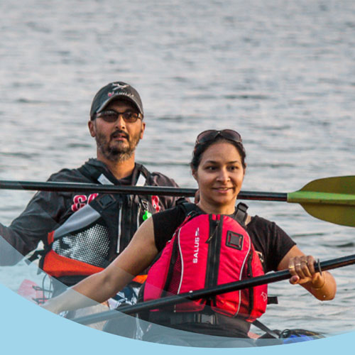 two people canoeing