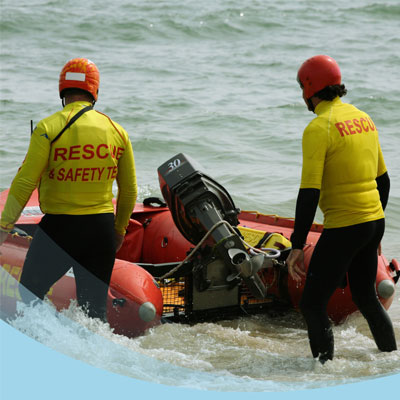 water rescue workers about to enter their small rescue boat