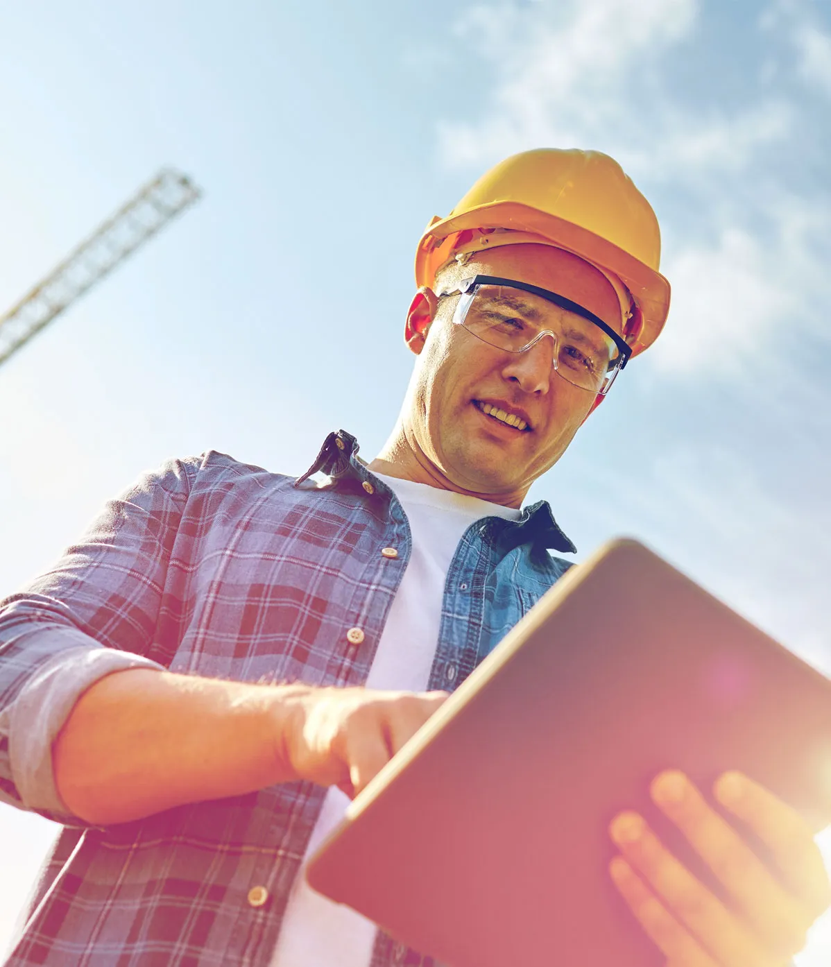 Features and reports - A technician using a tablet